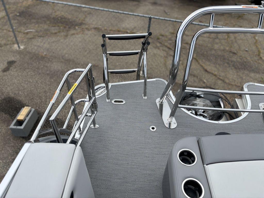 2025 Godfrey Monaco 235 DFL boat deck with seating and stainless steel ladder.