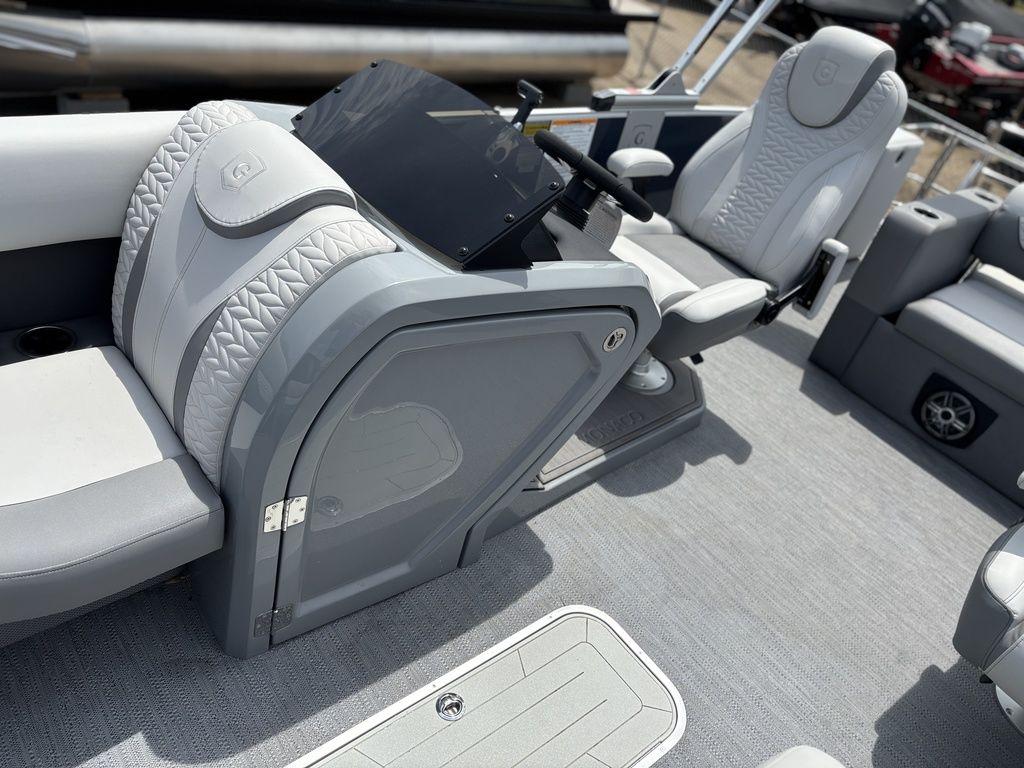2025 Godfrey Monaco 235 DFL boat interior with modern seating and steering console.
