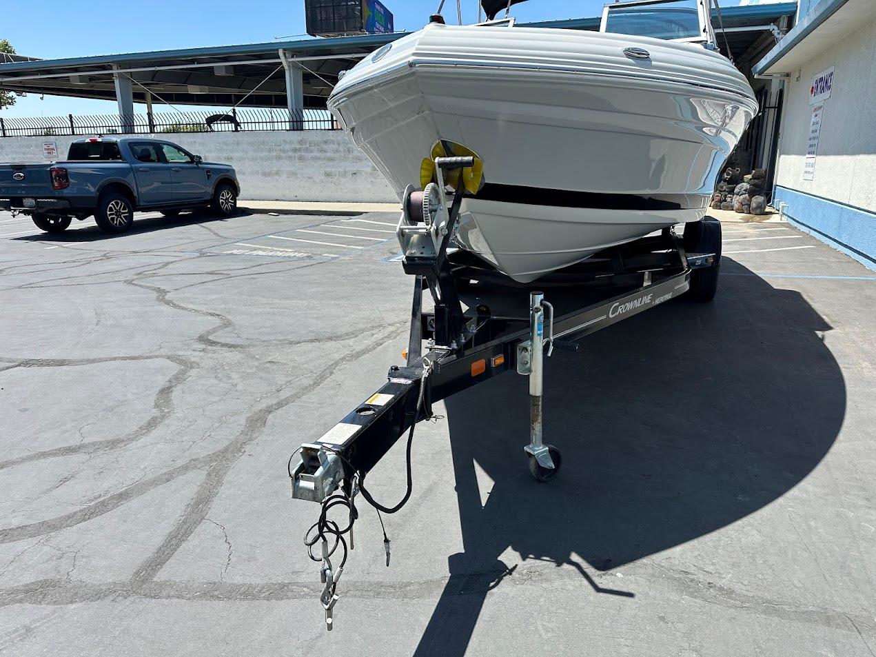 2019 Crownline 235 SS boat on trailer in parking lot.