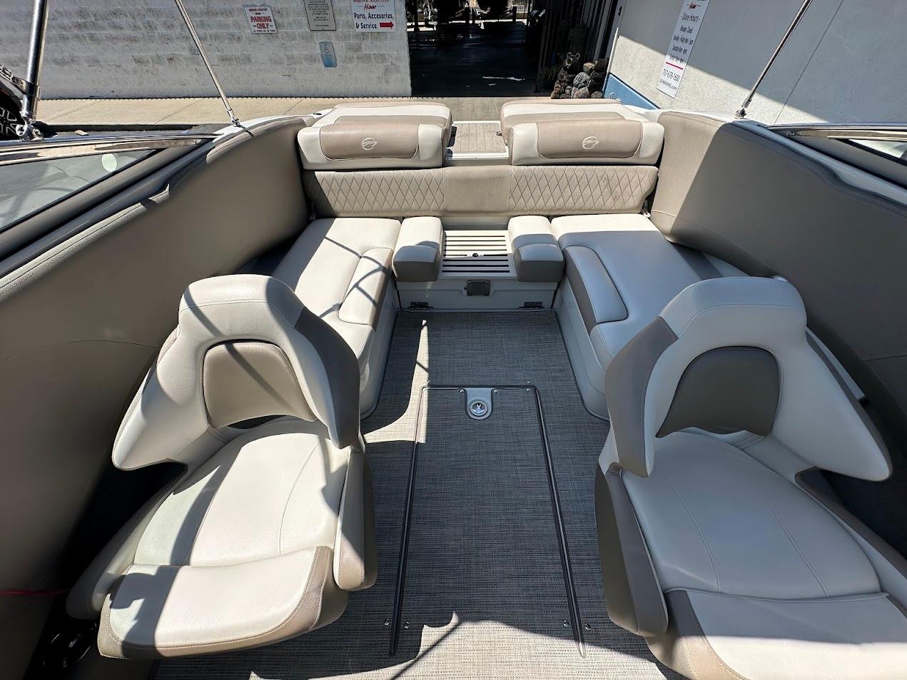 2019 Crownline 235 SS boat interior with beige seating and spacious layout.