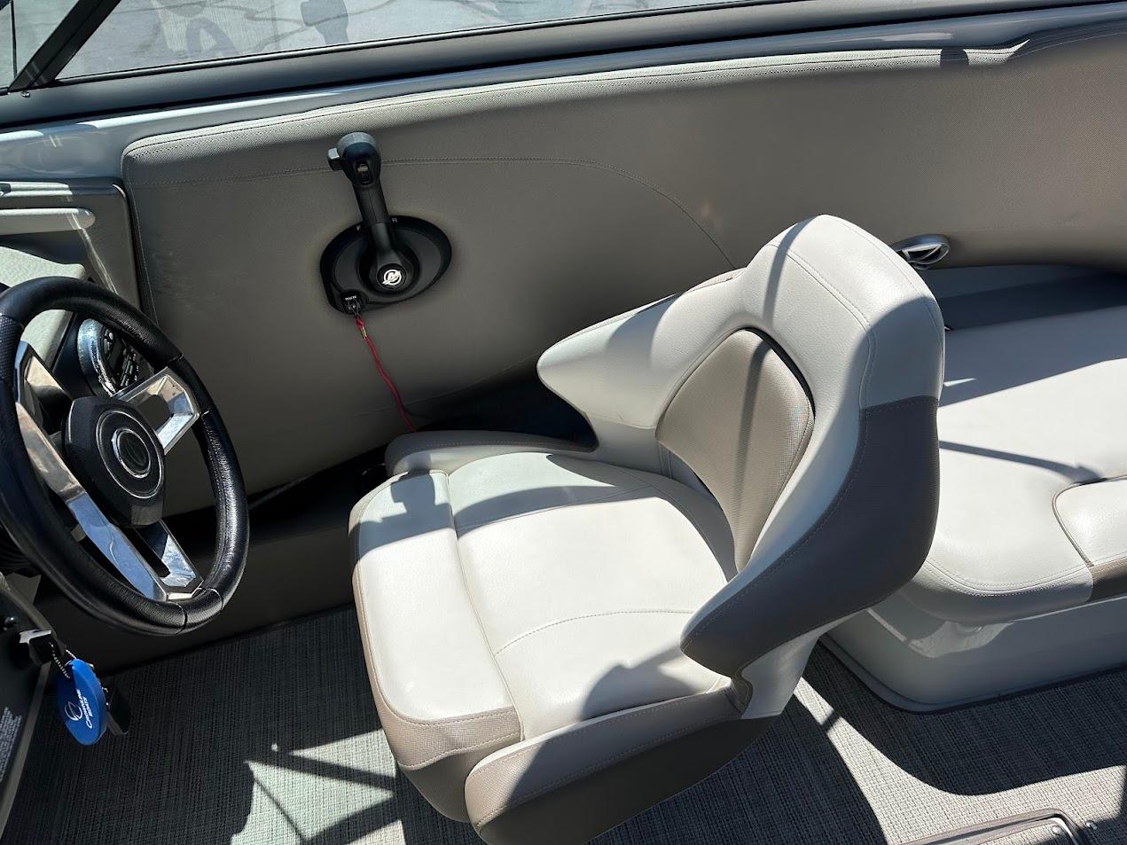 2019 Crownline 235 SS boat interior with steering wheel and seating.