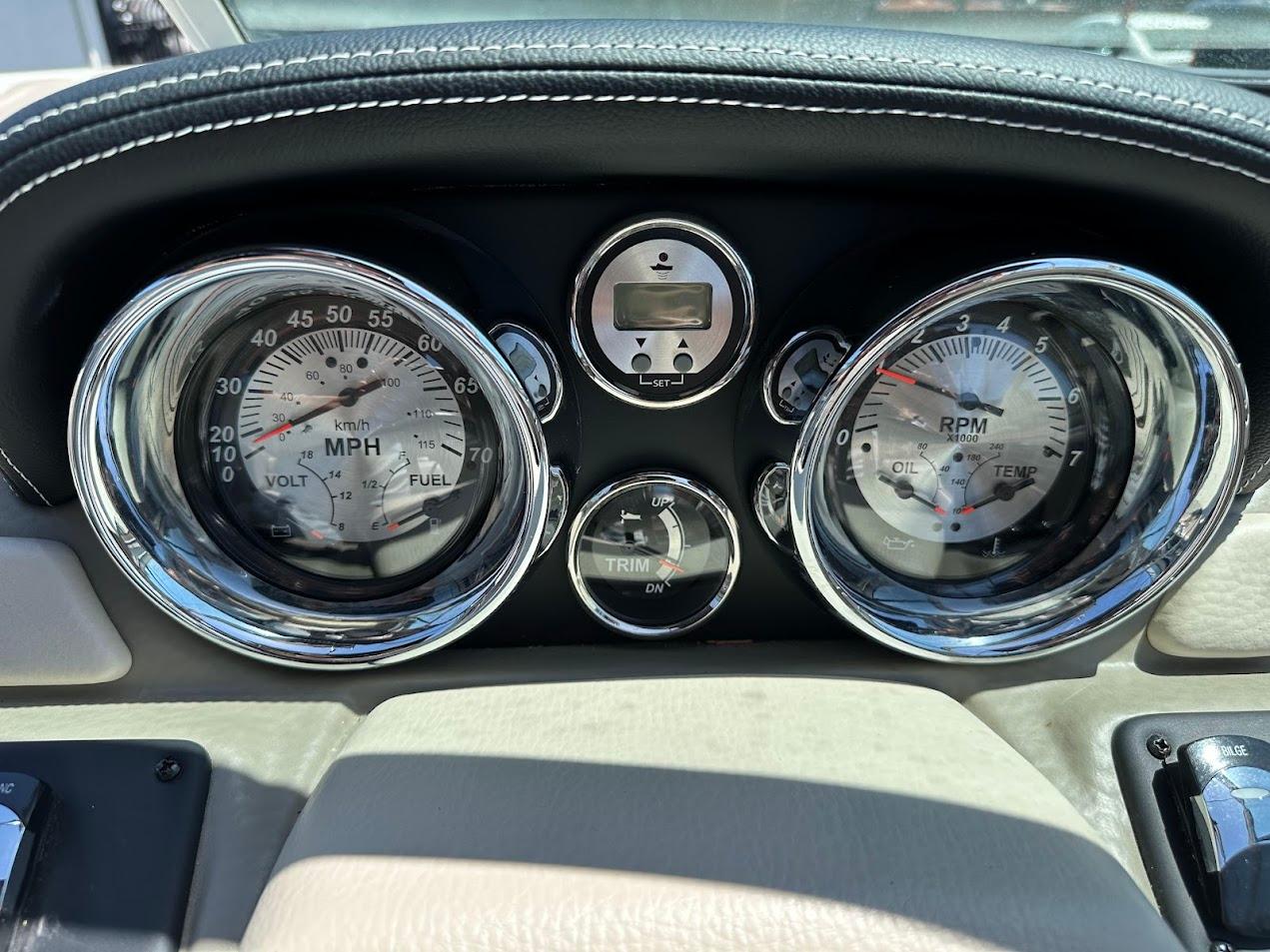 Dashboard of 2019 Crownline 235 SS boat with speedometer and RPM gauges.
