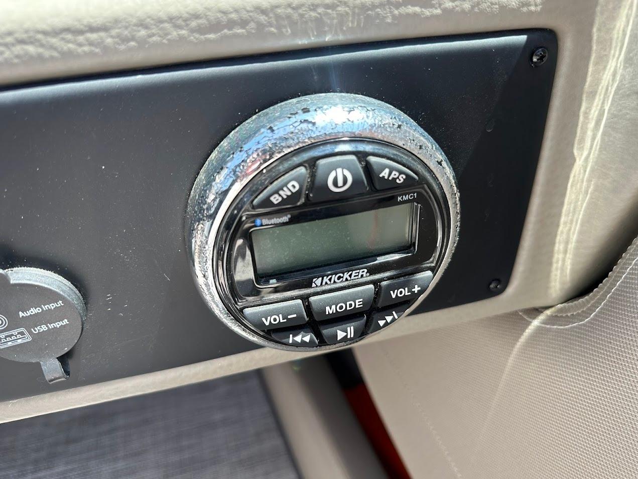 Kicker audio control panel in 2019 Crownline 235 SS boat interior.