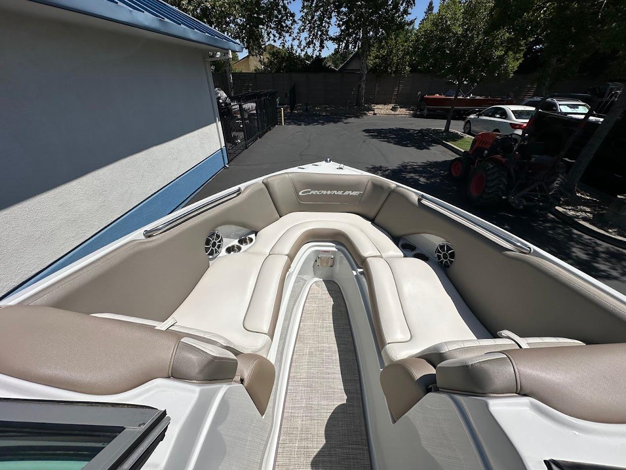 2019 Crownline 235 SS boat interior with beige seating and speakers.
