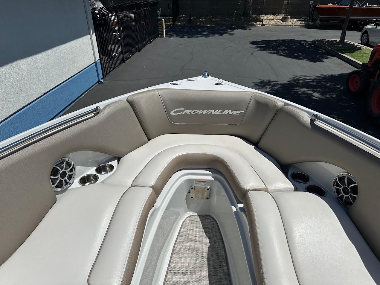 2019 Crownline 235 SS boat interior with cushioned seating and speakers.