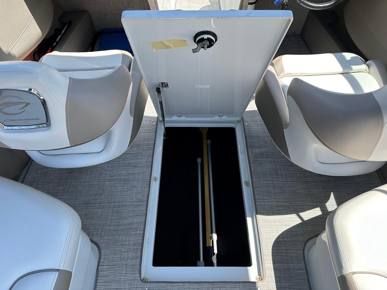 2019 Crownline 235 SS boat interior with open storage compartment and seating.