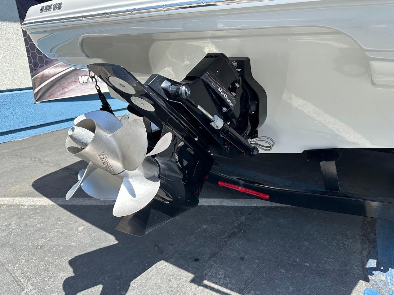 2019 Crownline 235 SS boat stern with propeller and outdrive in sunlight.