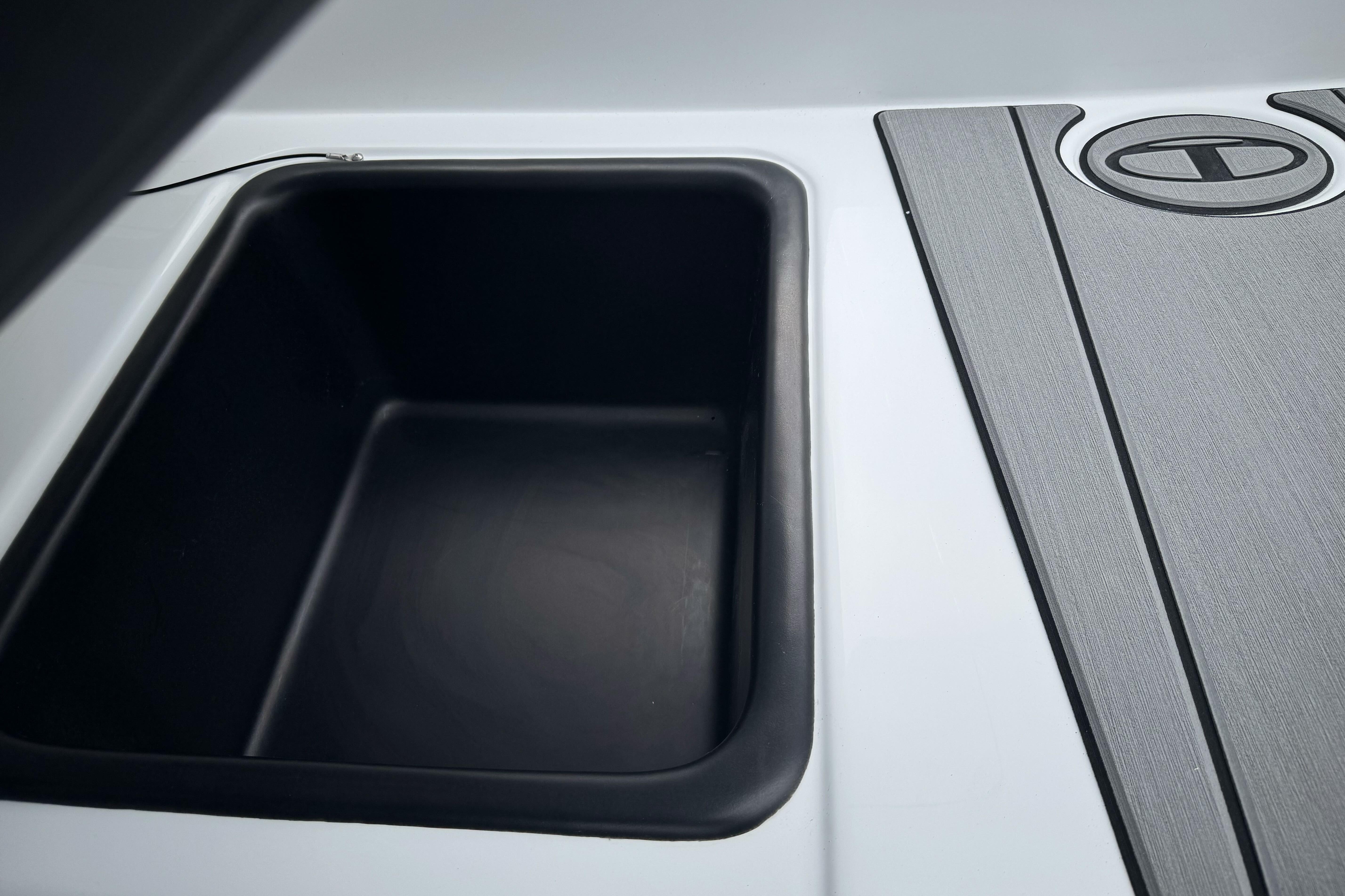 Storage compartment on 2026 Tahoe T18 boat, featuring sleek design and durable materials.