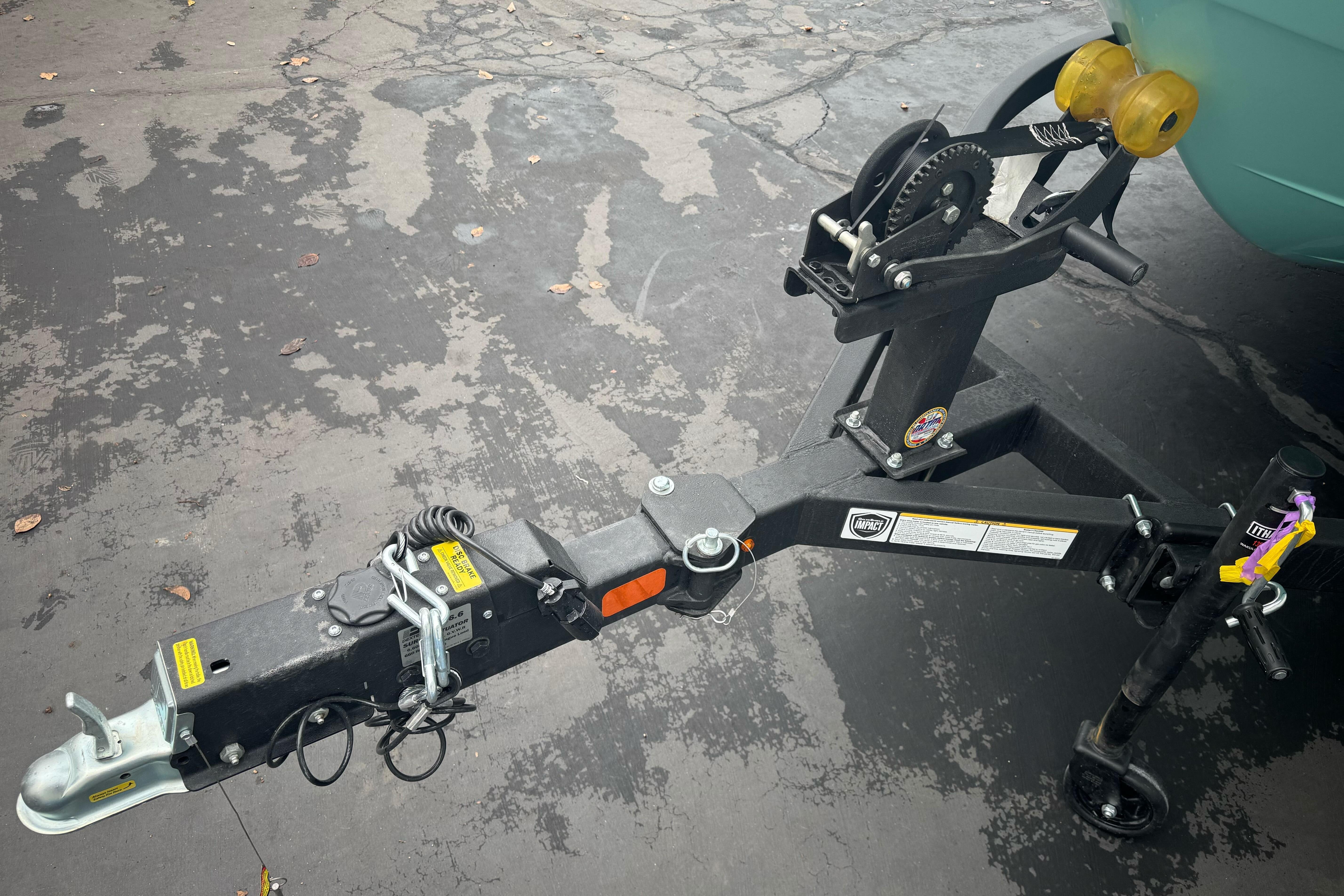 Trailer hitch of 2026 Tahoe T18 on a paved surface.