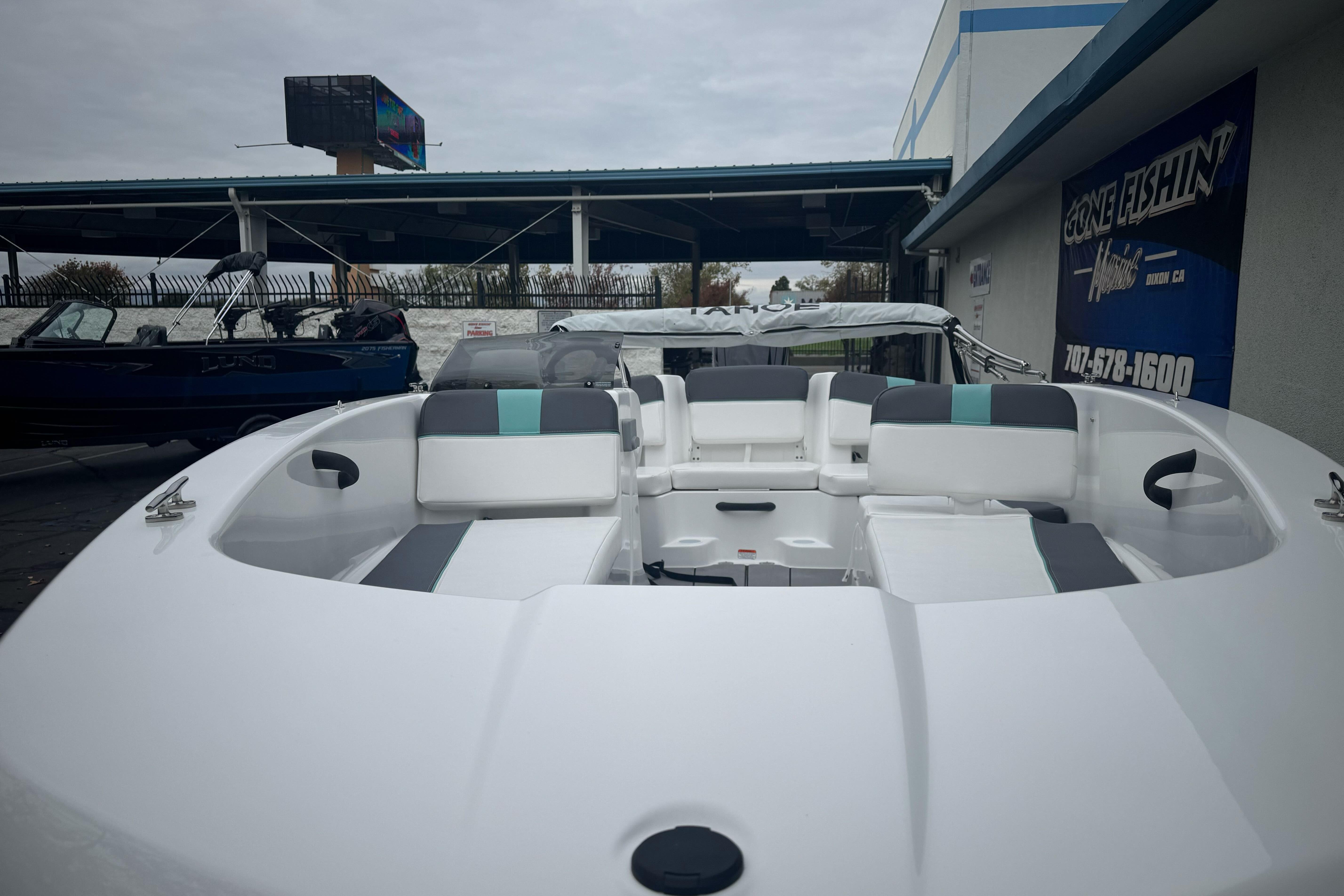 2026 Tahoe T18 boat with sleek white and gray seating, displayed outdoors.
