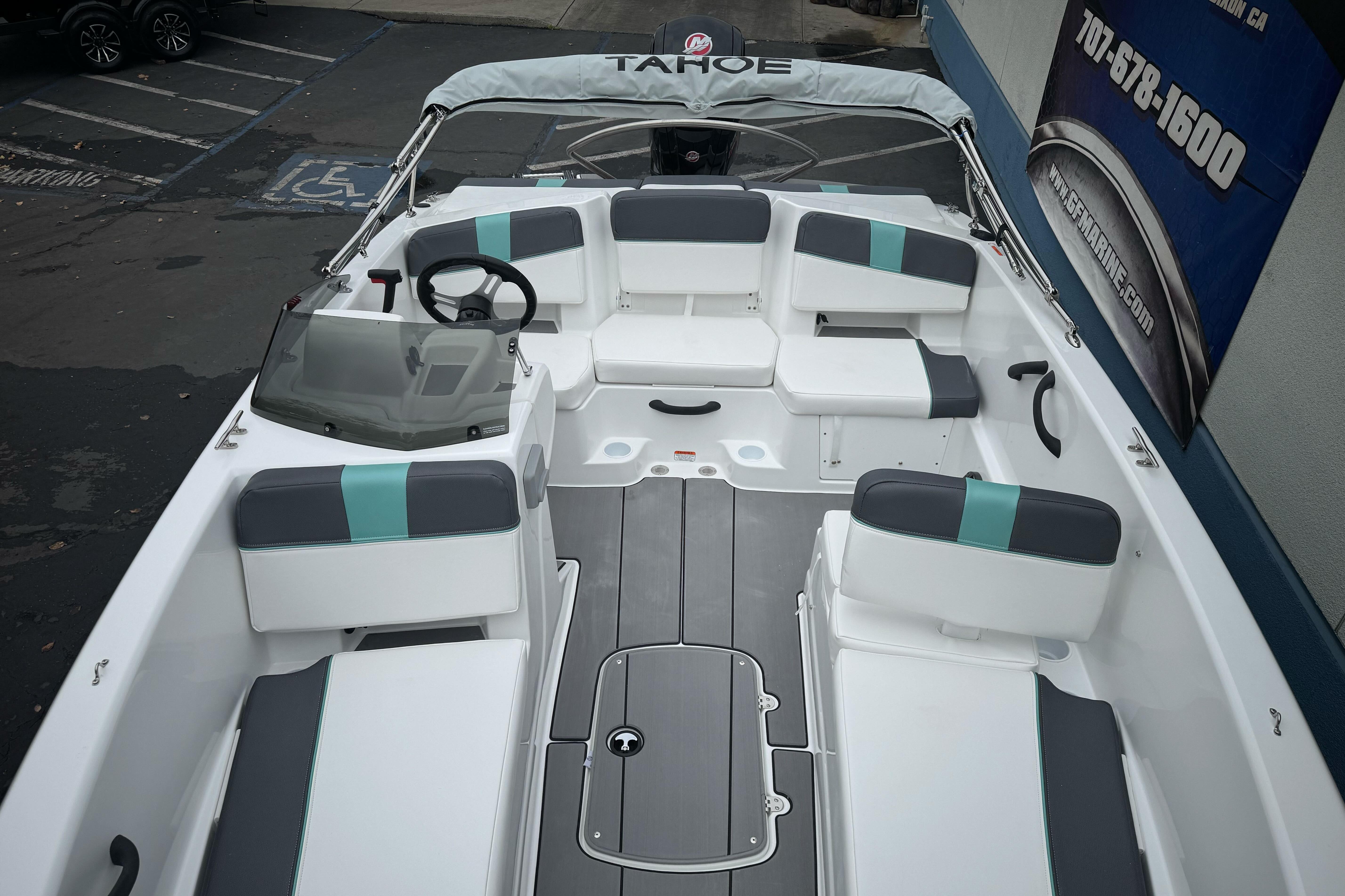 2026 Tahoe T18 boat interior with modern seating and steering wheel.