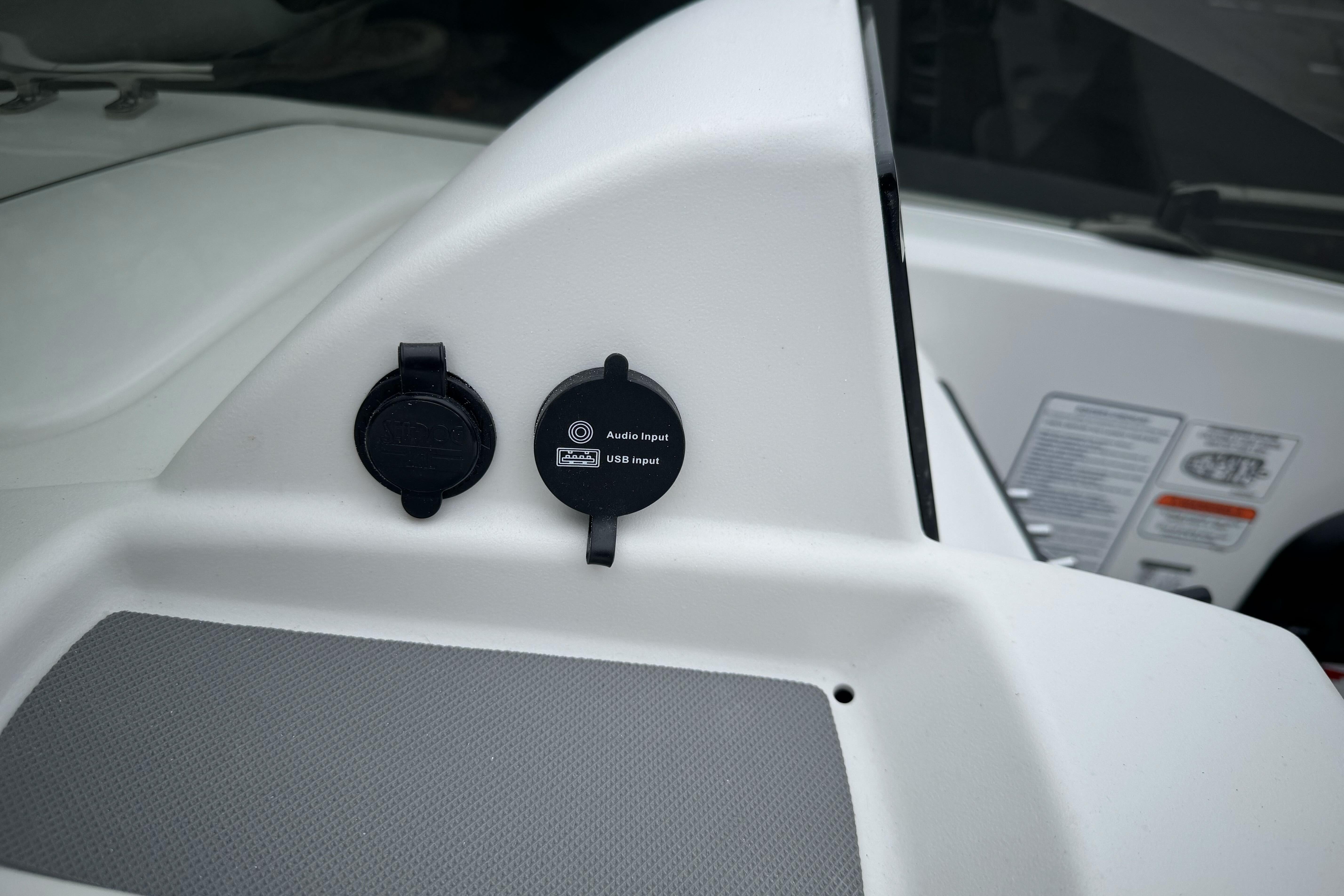 2026 Tahoe T18 boat dashboard with audio and USB input ports.