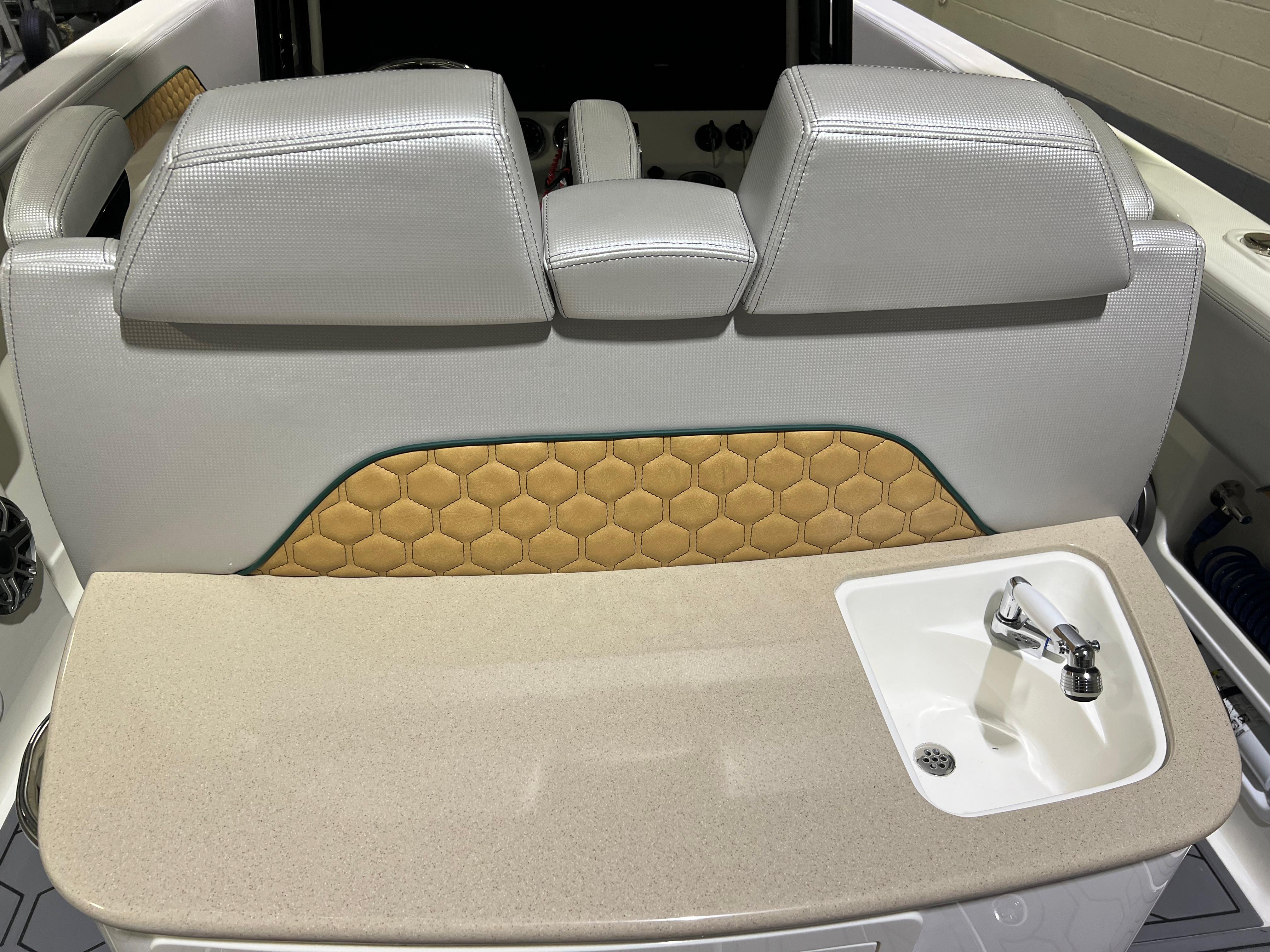 Blackwater-36 Sport 2022 -MI-US-2022 Blackwater 36 Sport boat interior with cushioned seating and built-in sink.-8355779 | Thumbnail