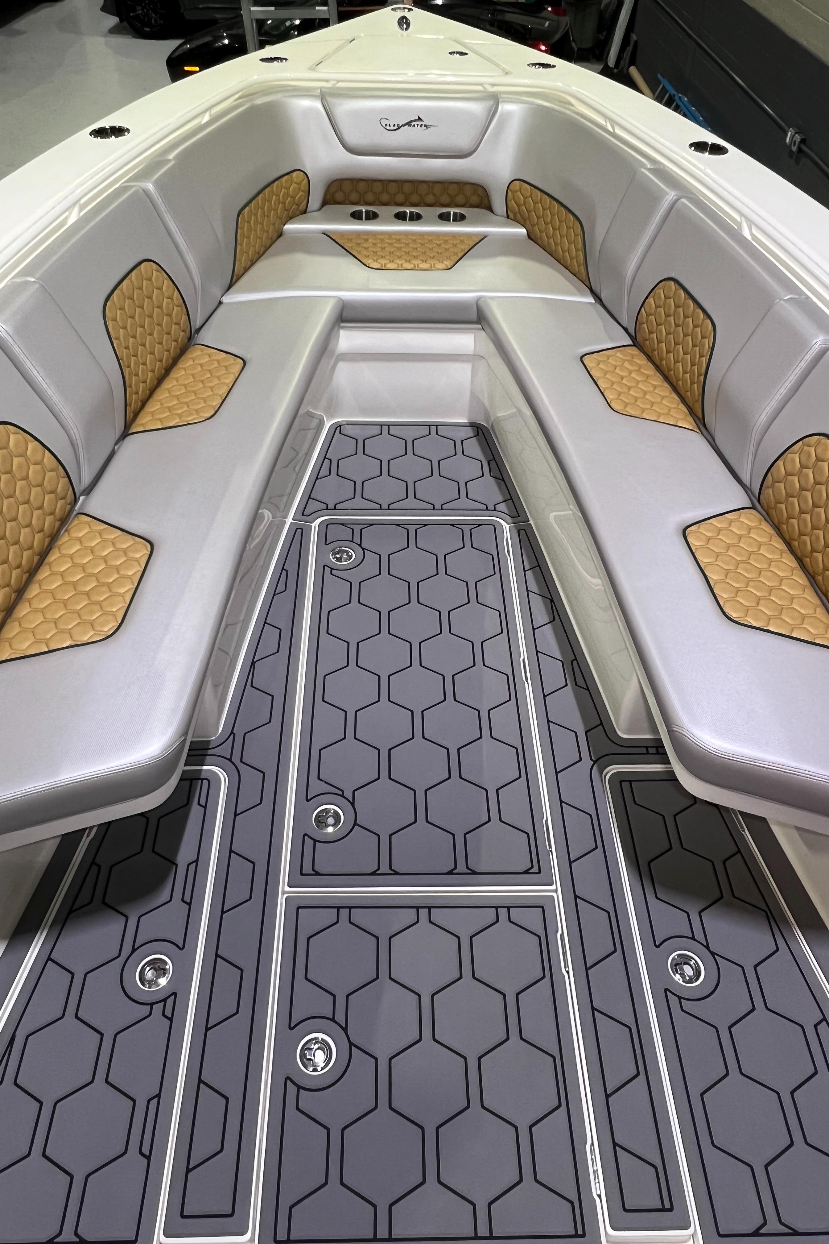 Blackwater-36 Sport 2022 -MI-US-2022 Blackwater 36 Sport boat interior with cushioned seating and hexagonal floor design.-8355779 | Thumbnail