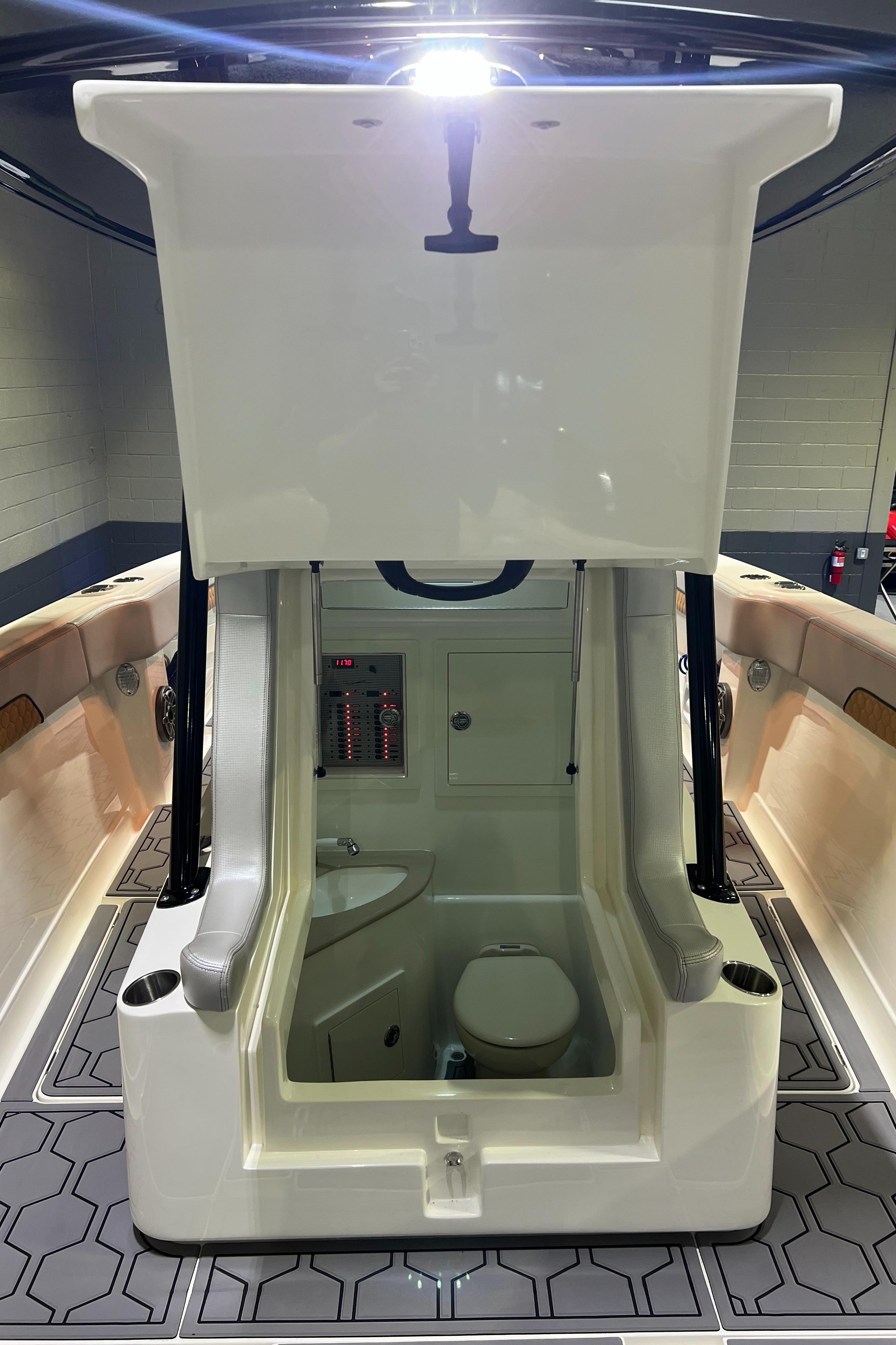 Blackwater-36 Sport 2022 -MI-US-2022 Blackwater 36 Sport boat interior with open hatch and visible toilet.-8355779 | Thumbnail