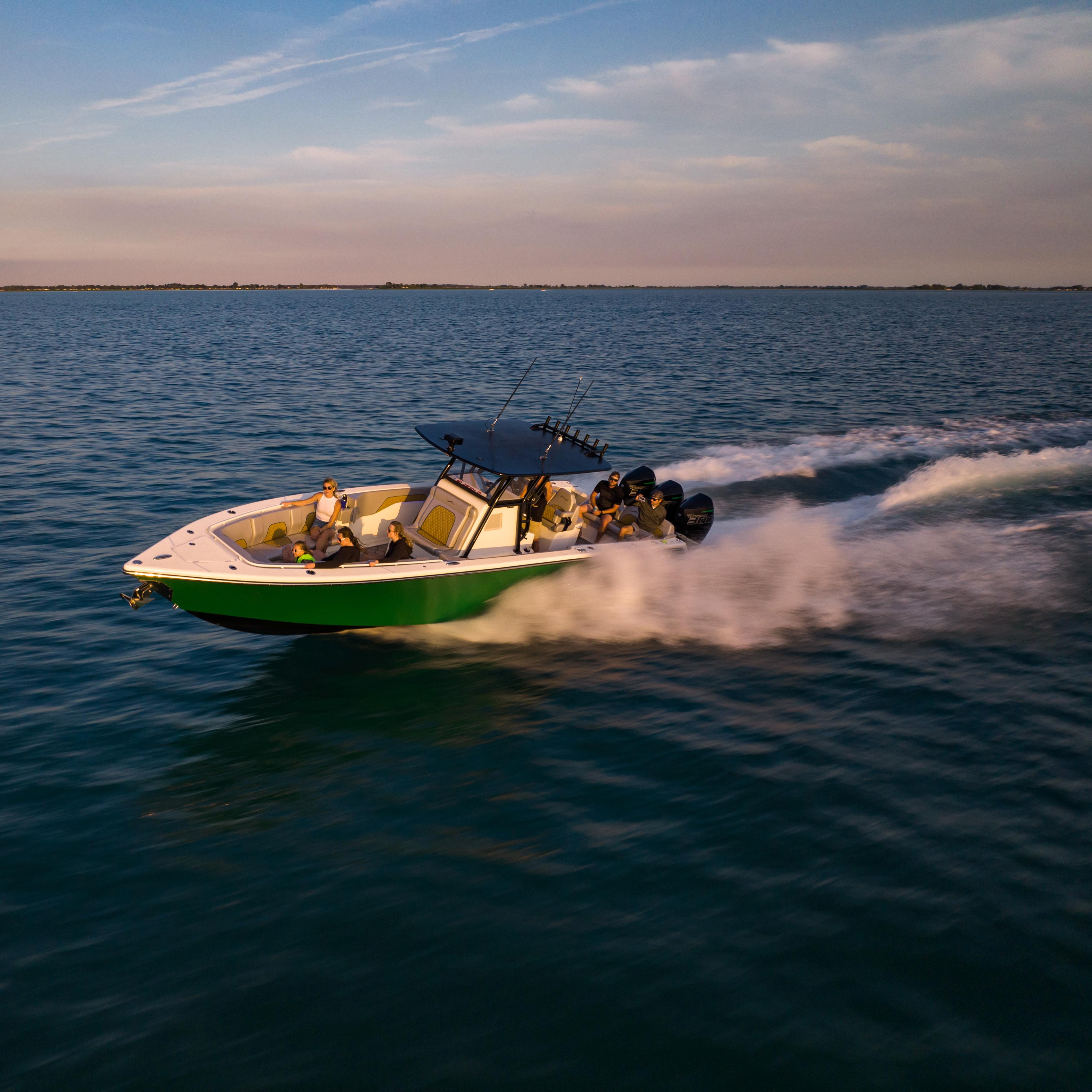 Blackwater-36 Sport 2022 -MI-US-2022 Blackwater 36 Sport boat speeding on open water at sunset.-8355779 | Thumbnail