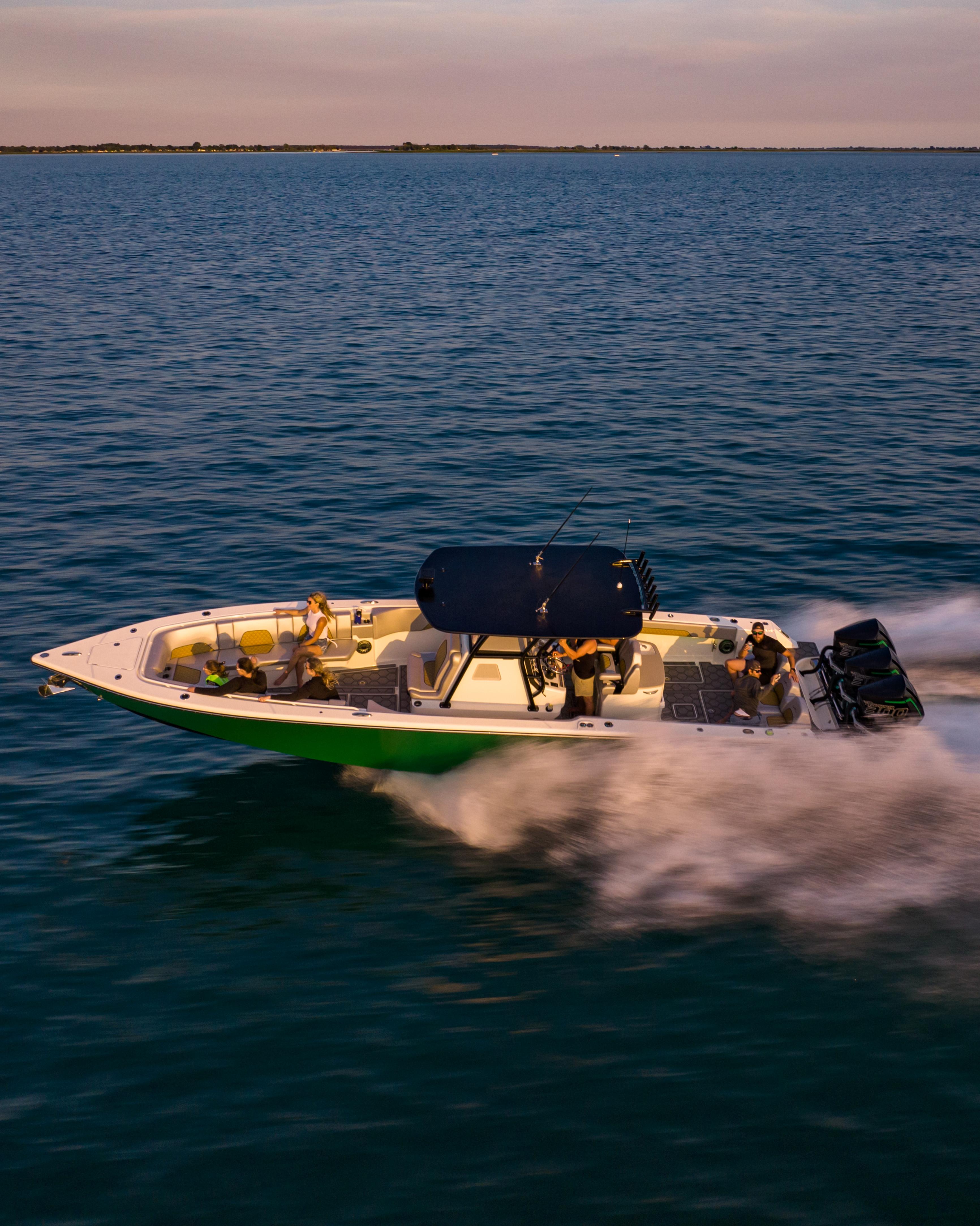 Blackwater-36 Sport 2022 -MI-US-2022 Blackwater 36 Sport boat speeding on open water at sunset.-8355779 | Thumbnail
