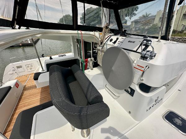 2020 Lagoon 40 catamaran cockpit with helm, seating, and navigation equipment.