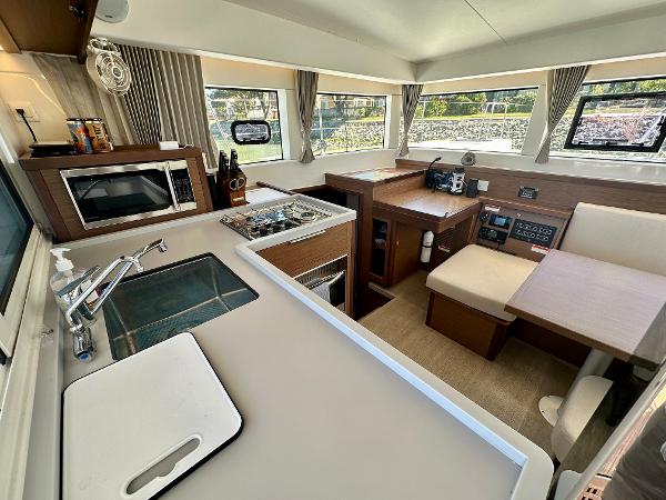 Interior of 2020 Lagoon 40 catamaran featuring modern kitchen and dining area.