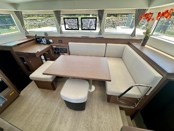 Interior of 2020 Lagoon 40 yacht with modern seating and dining area.