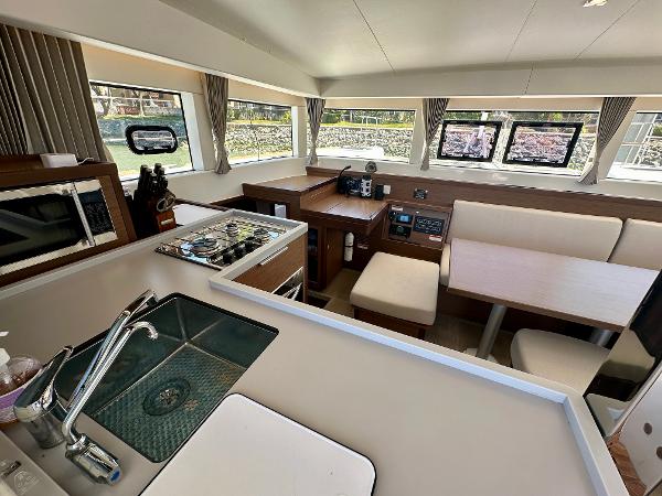 Interior of 2020 Lagoon 40 catamaran featuring modern kitchen and dining area.