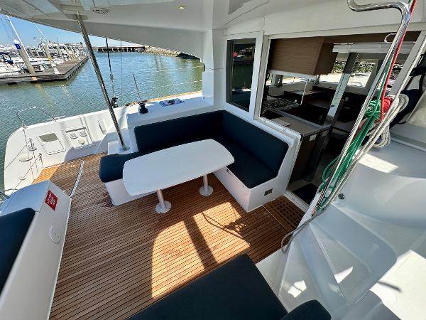 2020 Lagoon 40 catamaran with spacious outdoor seating and dining area at the marina.