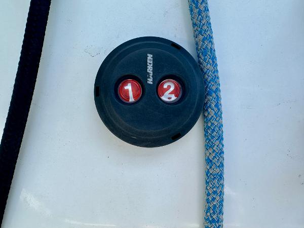 Battery switch on 2020 Lagoon 40 catamaran with ropes nearby.