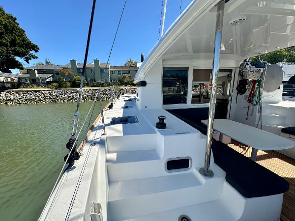2020 Lagoon 40 catamaran docked, showcasing spacious deck and seating area.