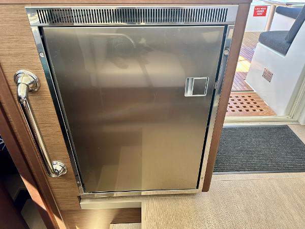 Stainless steel refrigerator on 2020 Lagoon 40 catamaran interior.