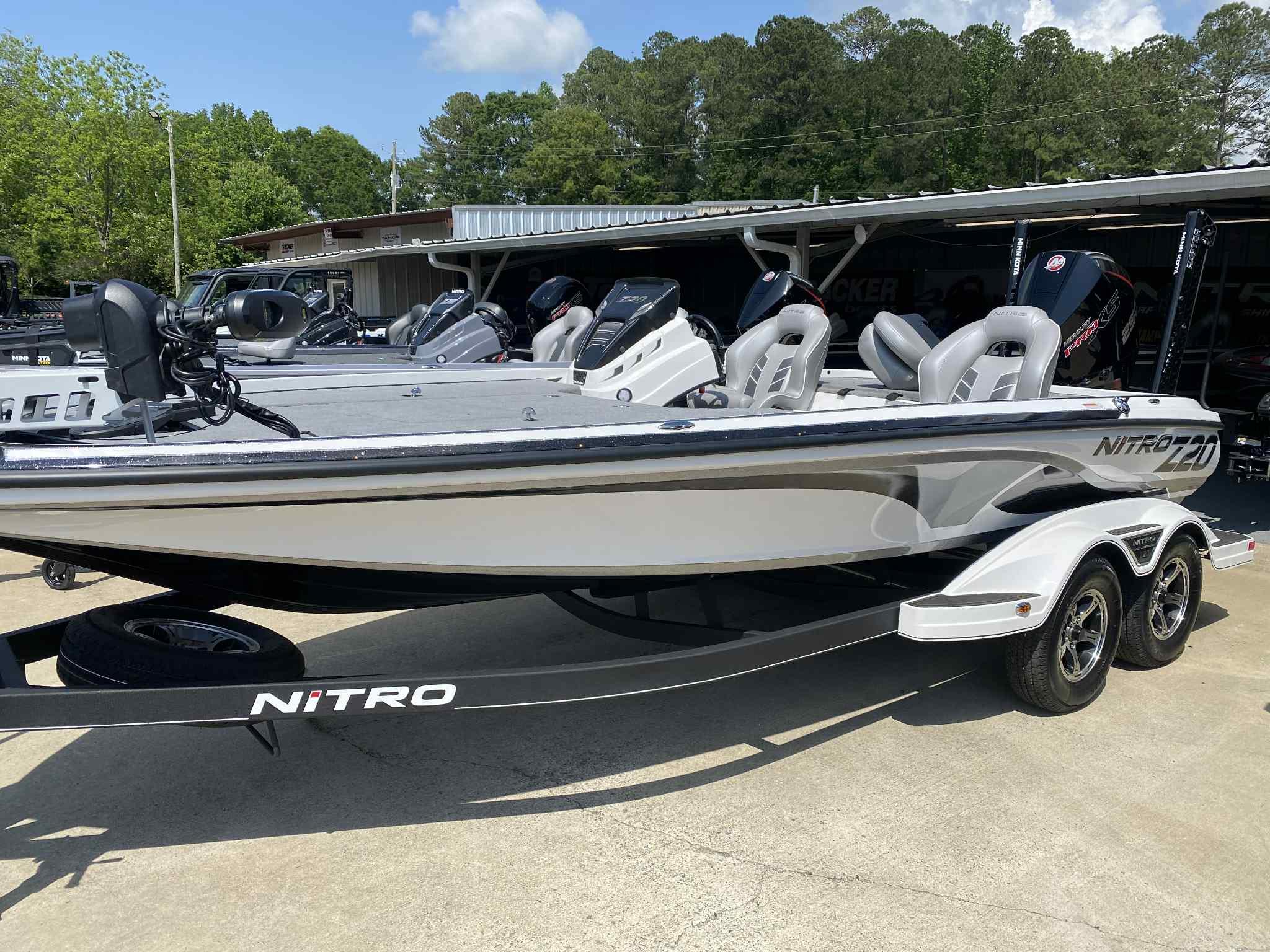 2024 Nitro Z20 Pro boat with sleek design on a trailer, parked outdoors.