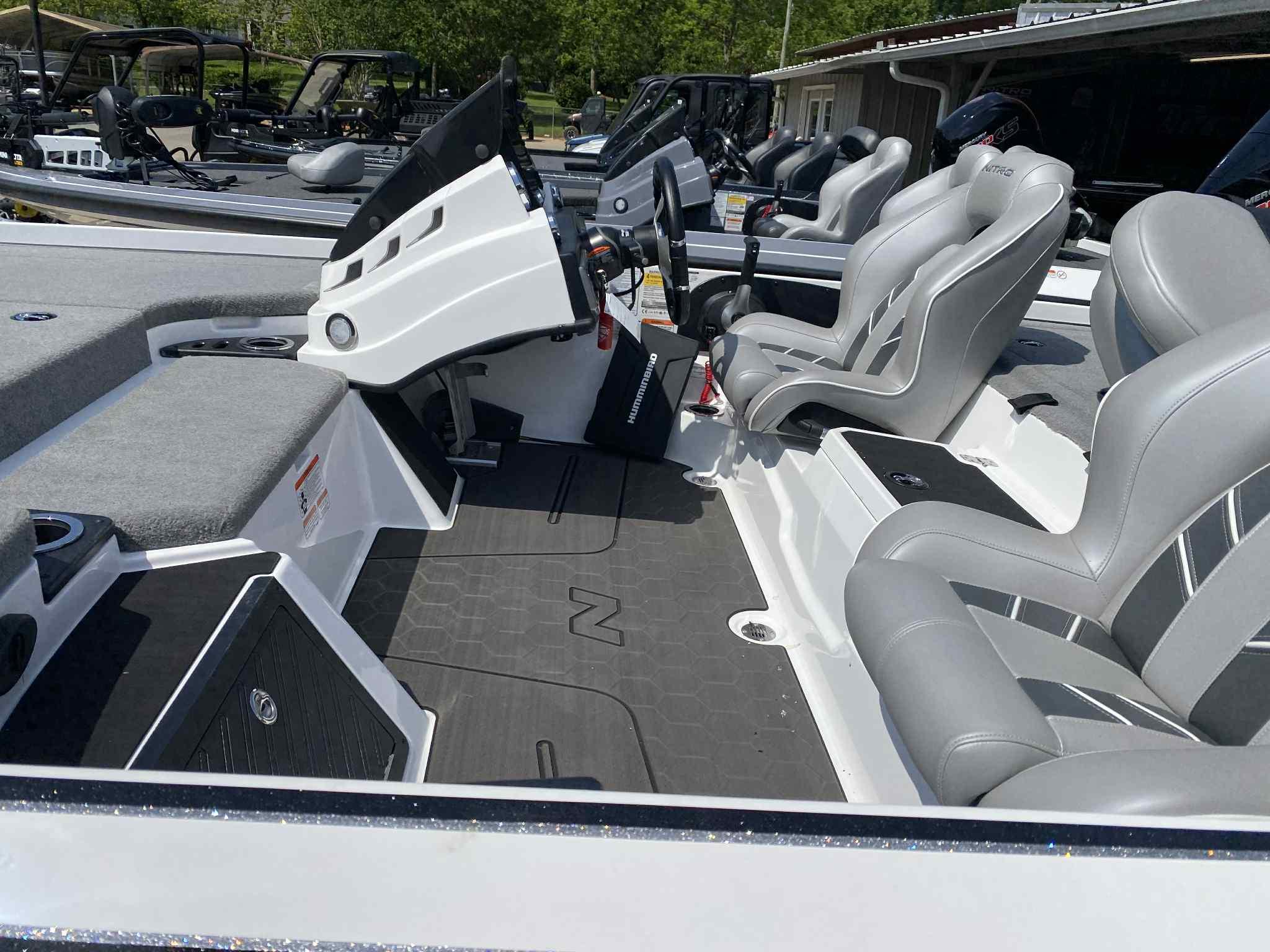 2024 Nitro Z20 Pro boat interior with gray seating and modern dashboard.