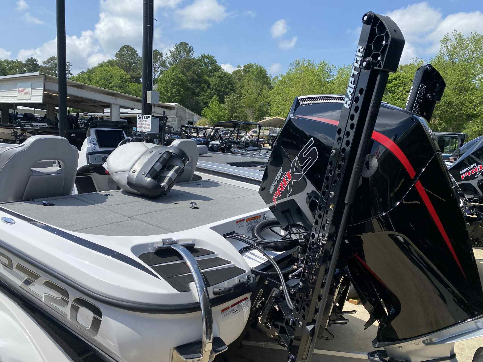 2024 Nitro Z20 Pro boat with powerful engine, parked outdoors under clear sky.