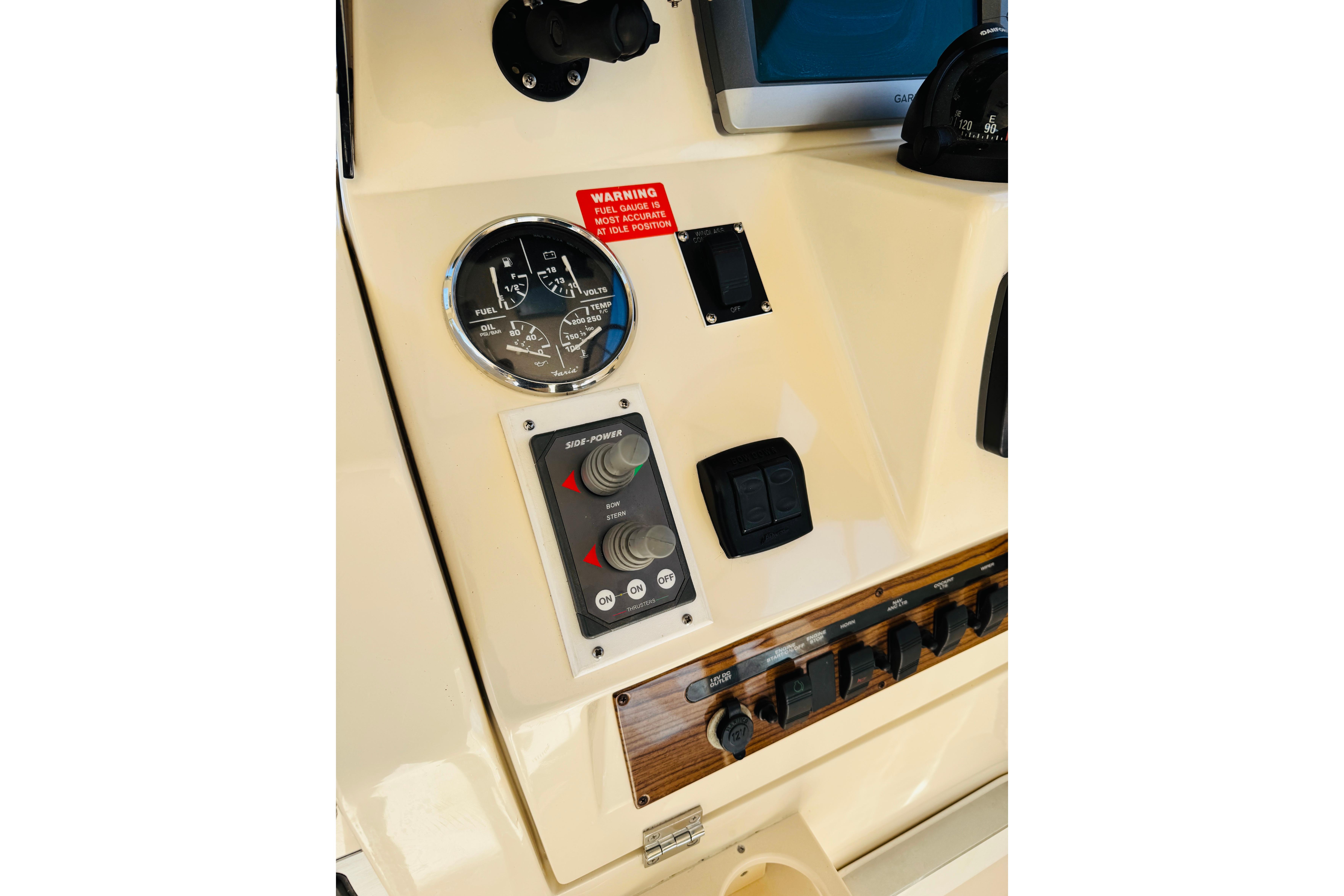 2006 Mainship Pilot 30 Sedan dashboard with gauges and controls.