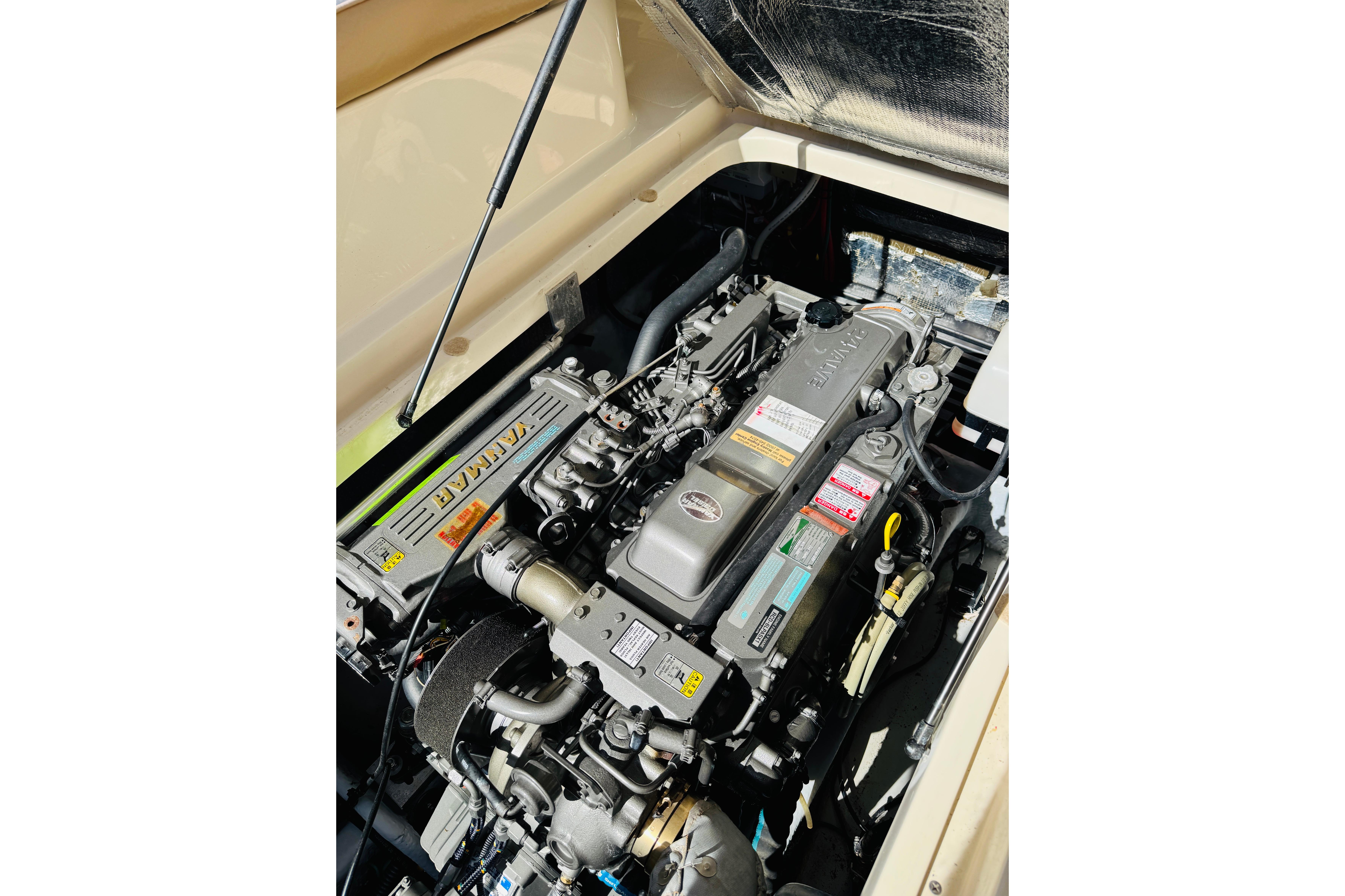 Engine compartment of a 2006 Mainship Pilot 30 Sedan, featuring a Yanmar engine.