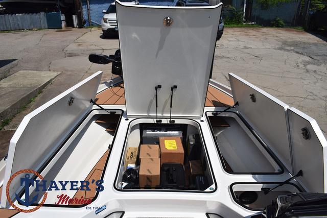 Open storage compartments on a 2025 Ranger Z520R Cup-Equipped boat at Thayer's Marine.