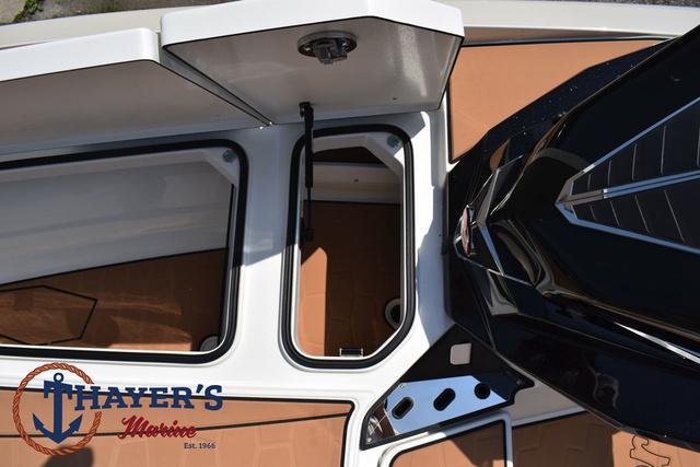 2025 Ranger Z520R Cup-Equipped boat deck with open storage compartments.