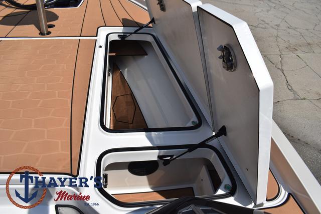 2025 Ranger Z520R Cup-Equipped boat storage compartments open, showcasing interior space.