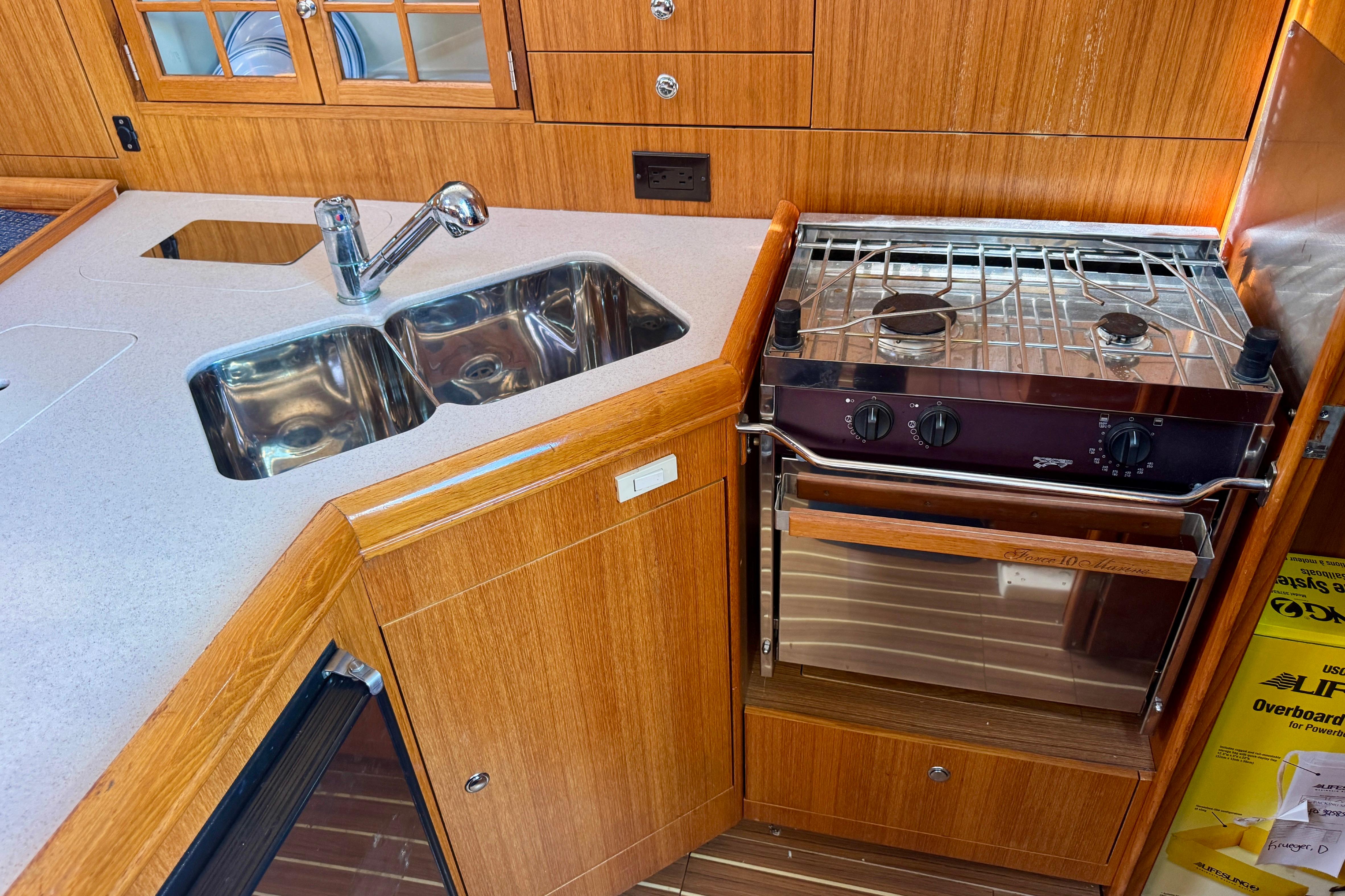 2003 Hunter 36 yacht kitchen with dual sink and stove.