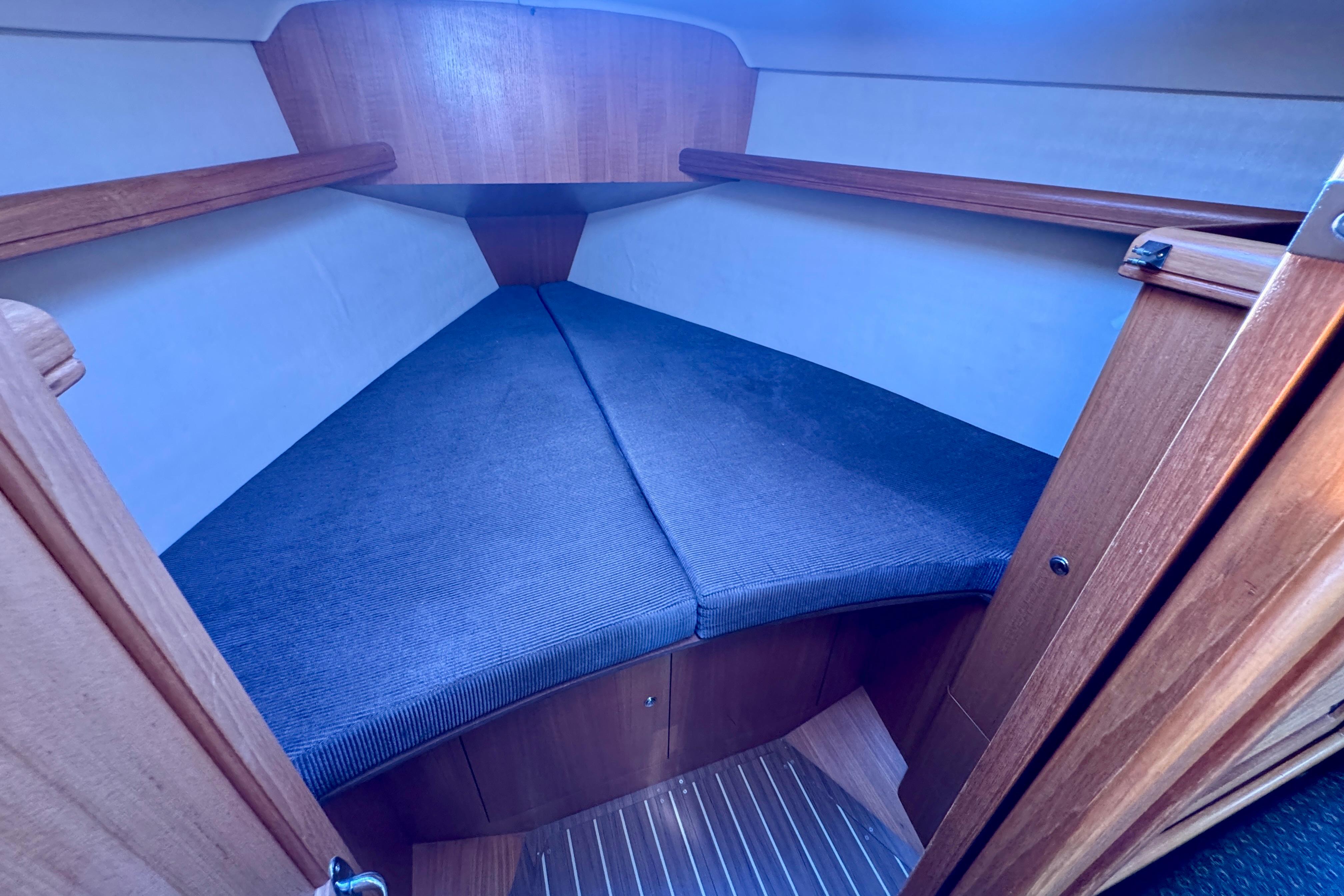 Interior cabin of a 2003 Hunter 36 sailboat with cozy V-berth.