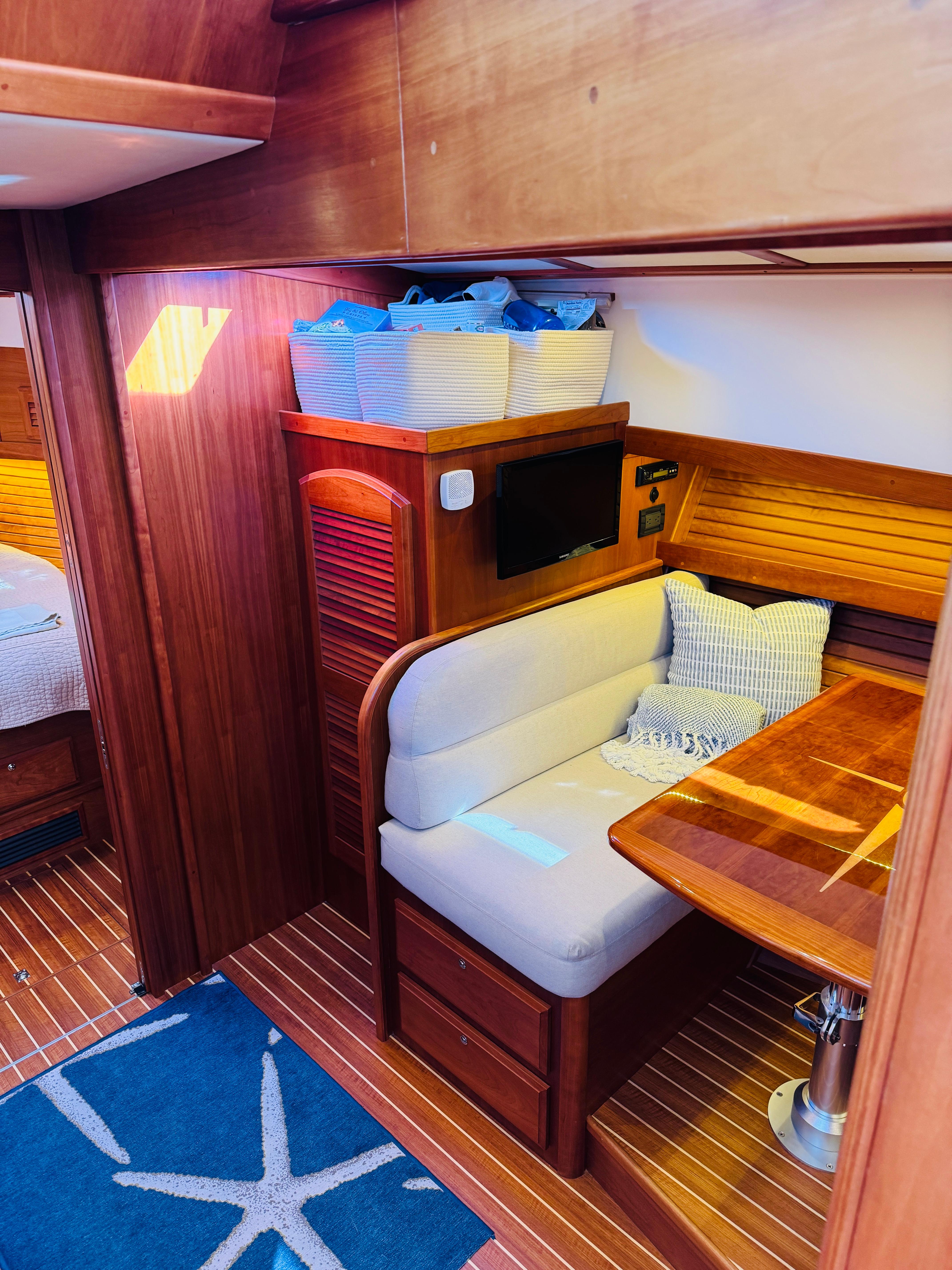 2018 Sabre 42 Salon Express interior with cozy seating and wooden finishes.