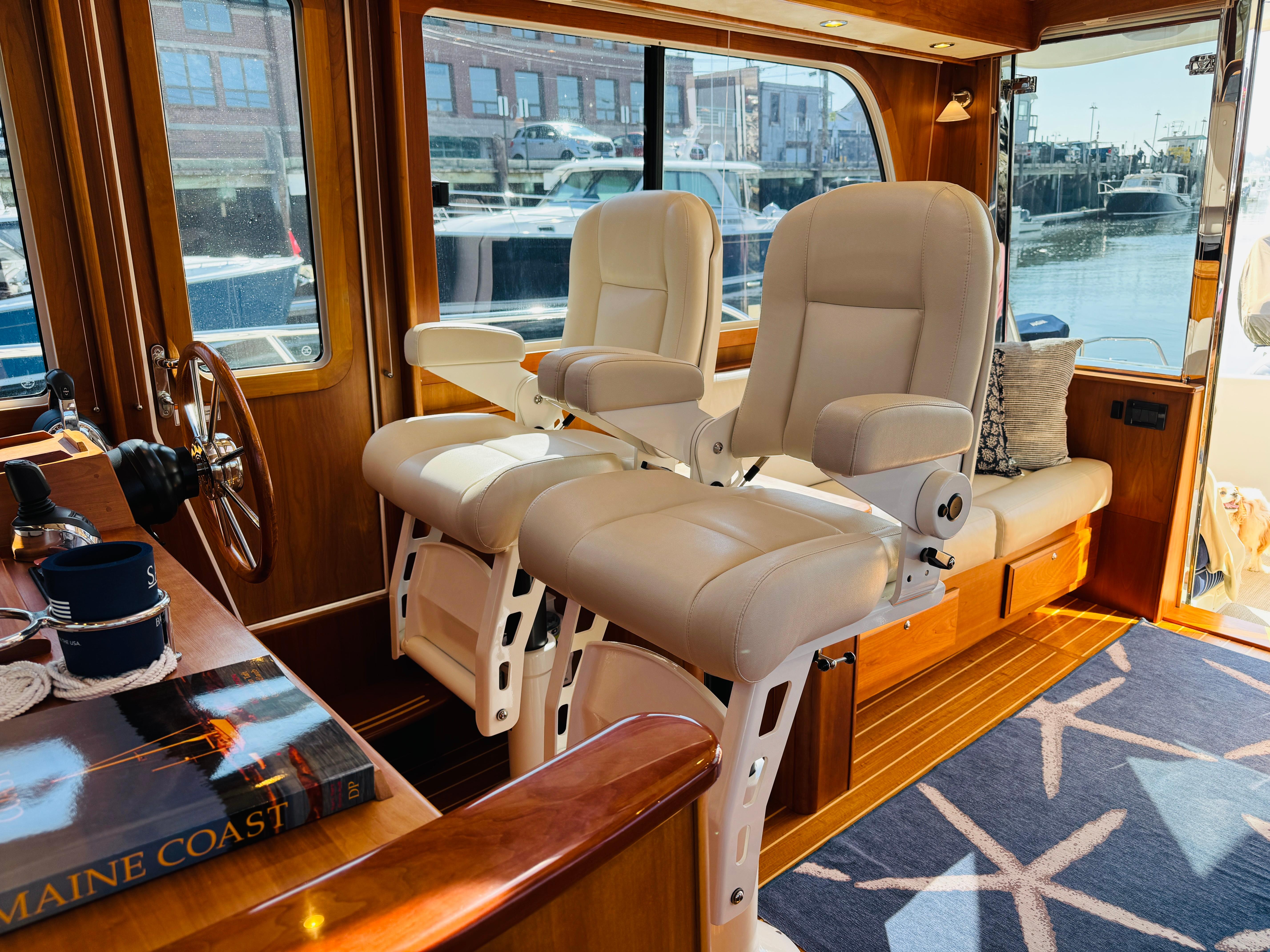 Interior of 2018 Sabre 42 Salon Express yacht with plush seating and wooden accents.