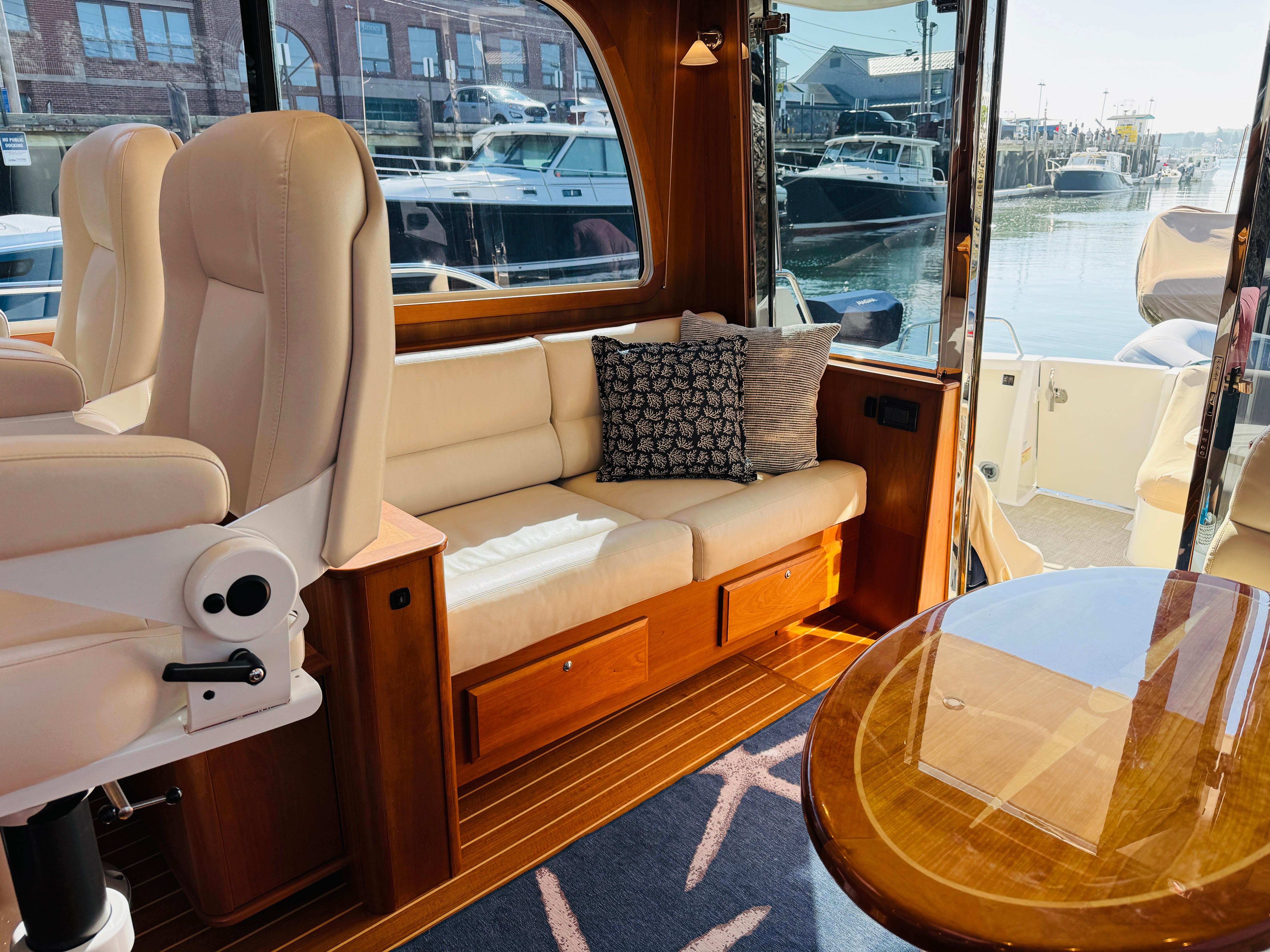 Interior of 2018 Sabre 42 Salon Express yacht with plush seating and elegant wood finishes.