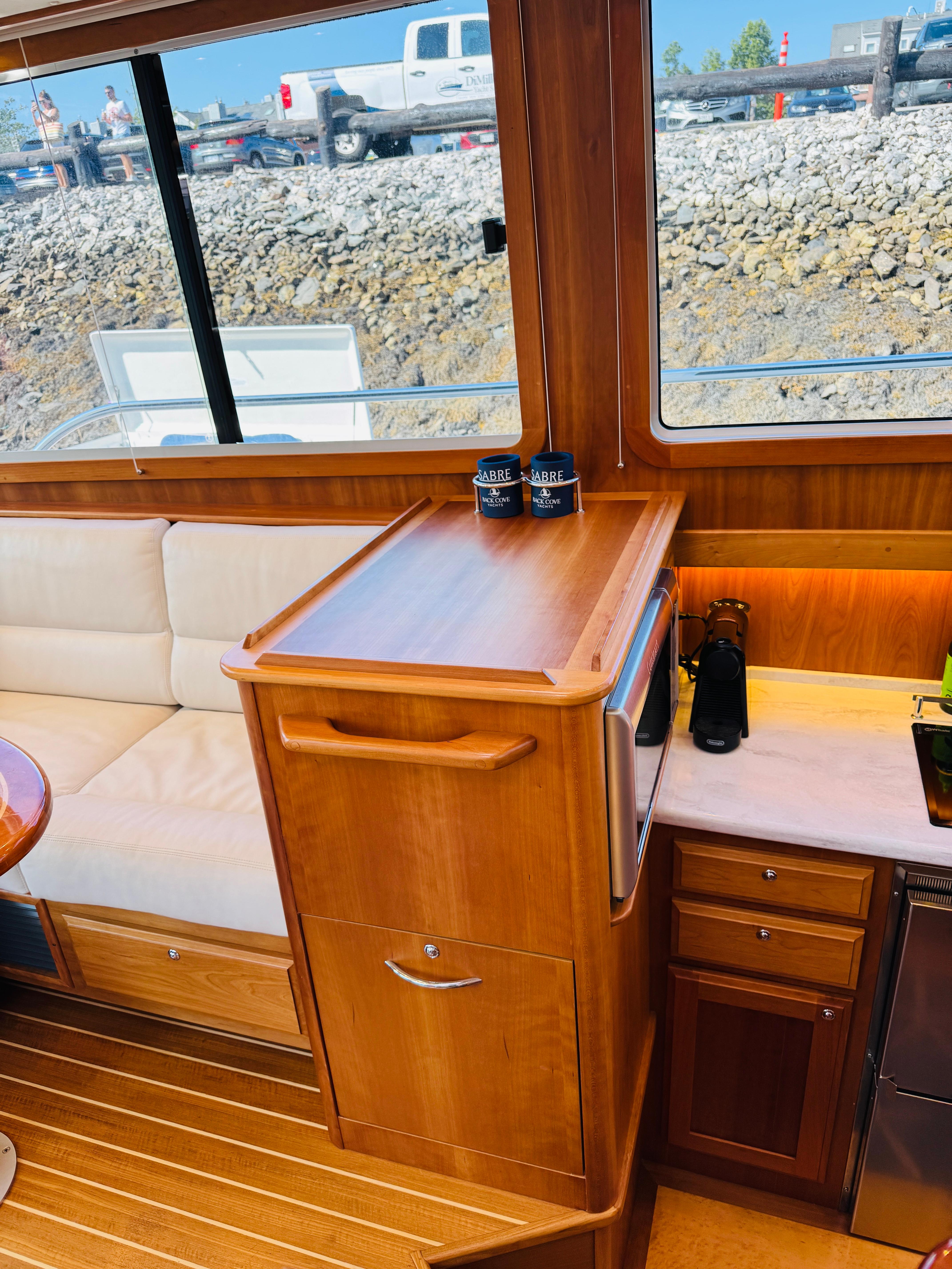 Interior of 2018 Sabre 42 Salon Express yacht with wooden cabinetry and seating.
