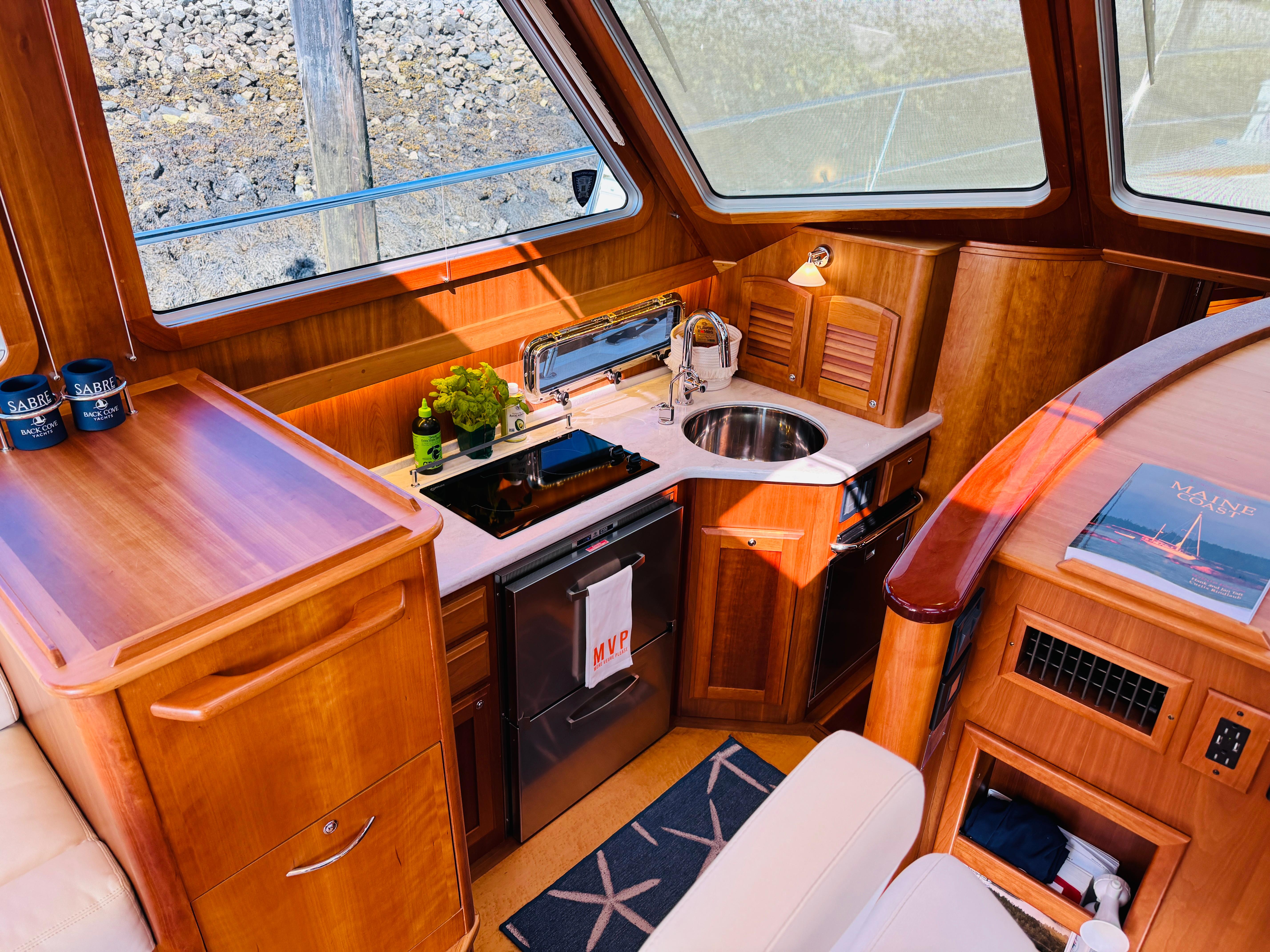 Luxurious 2018 Sabre 42 Salon Express yacht interior with elegant wood finish and modern amenities.