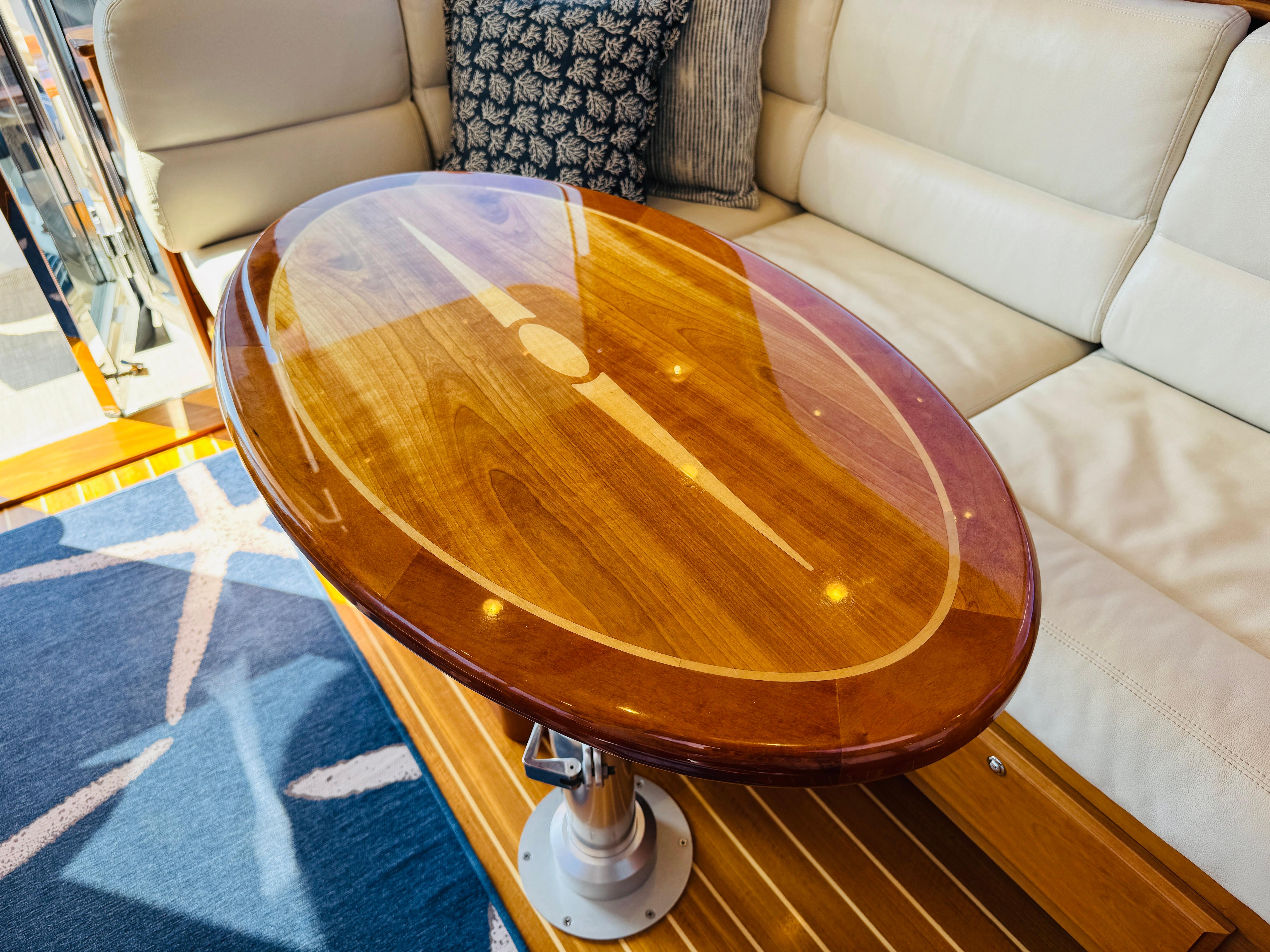 Luxurious wooden table in 2018 Sabre 42 Salon Express yacht interior.