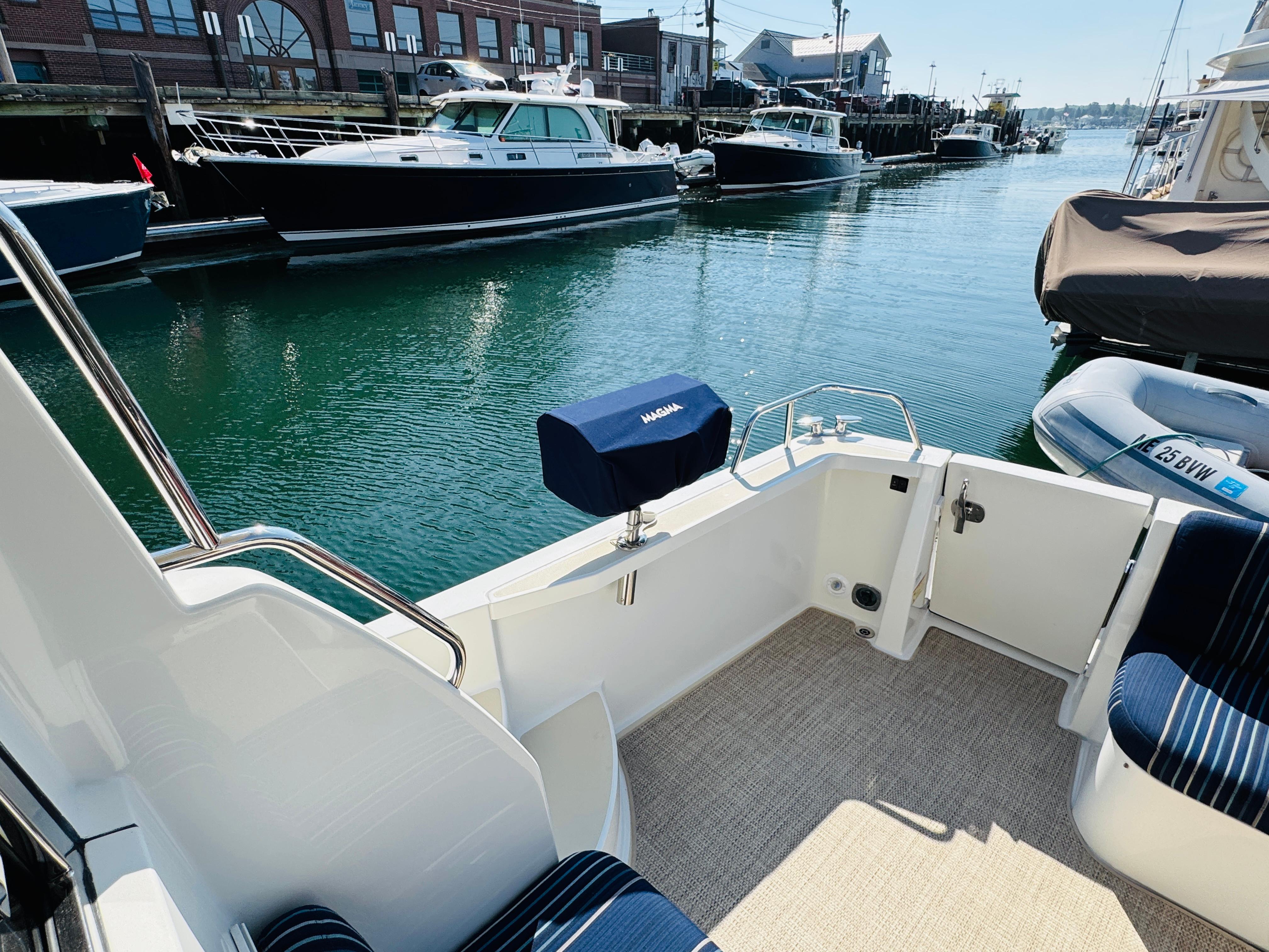2018 Sabre 42 Salon Express yacht docked in a marina, featuring a spacious deck area.