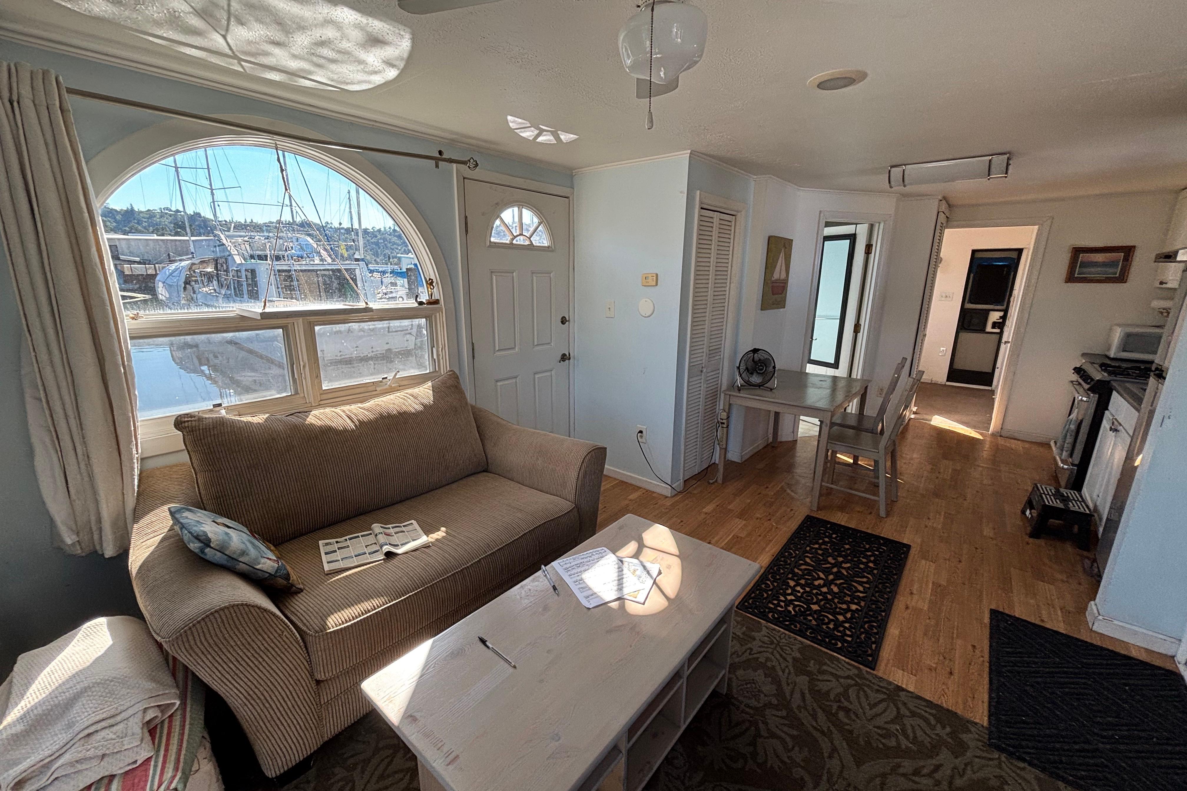 Interior of a 2004 River Floating Home with cozy living area and waterfront view.