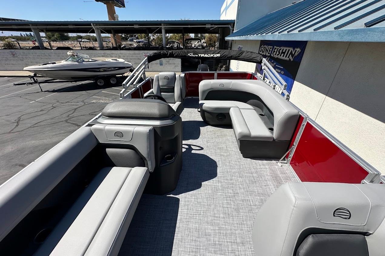 2026 Sun Tracker Party Barge 18 DLX pontoon boat with spacious seating and modern design.