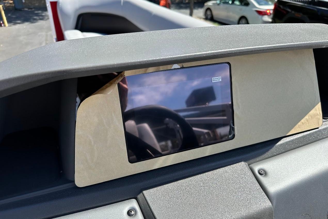 Dashboard of 2026 Sun Tracker Party Barge 18 DLX with protective screen cover.