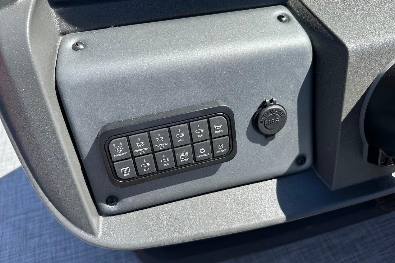 Control panel of 2026 Sun Tracker Party Barge 18 DLX with USB port and switches.